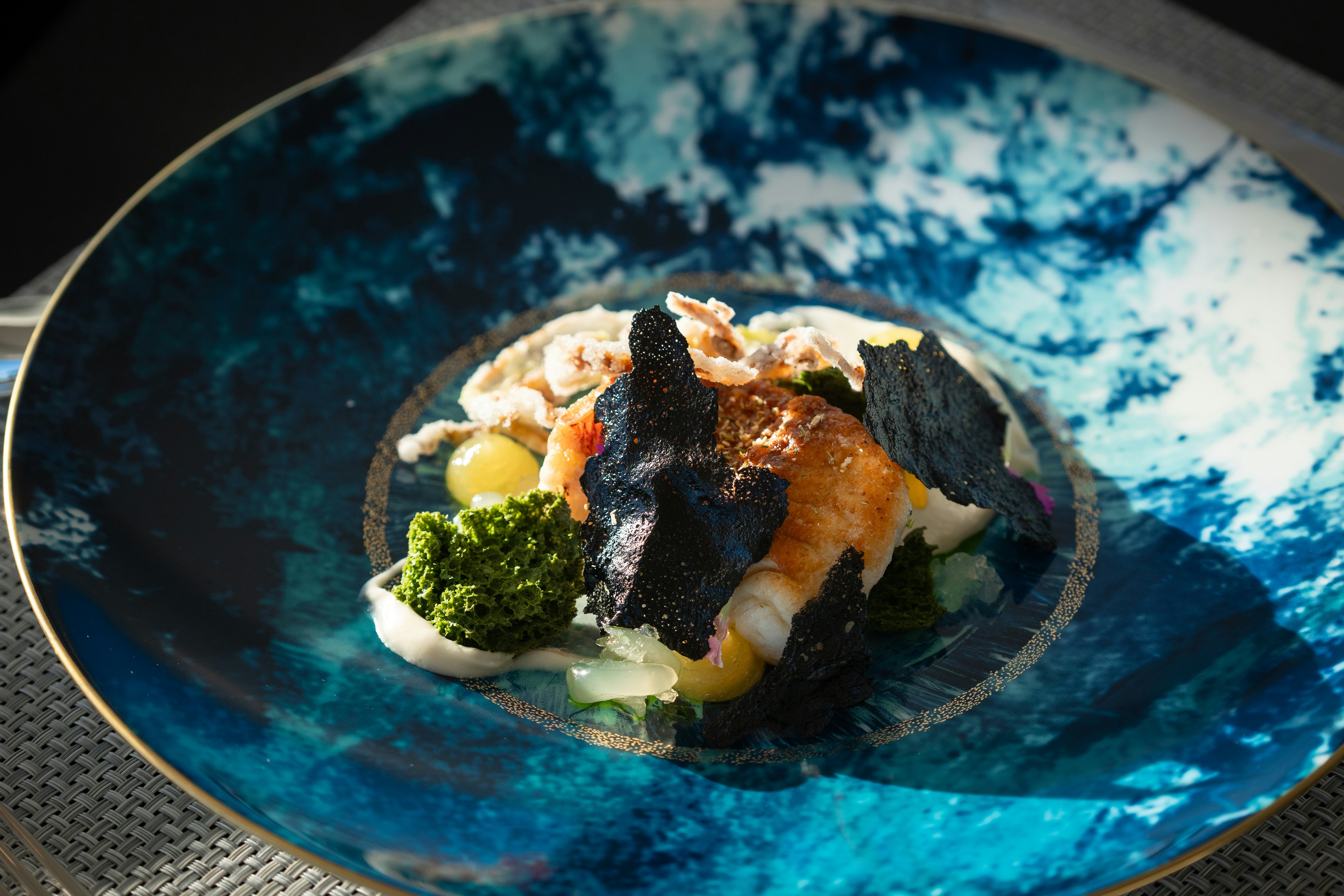 a plate of food aboard AIX Yacht for Charter