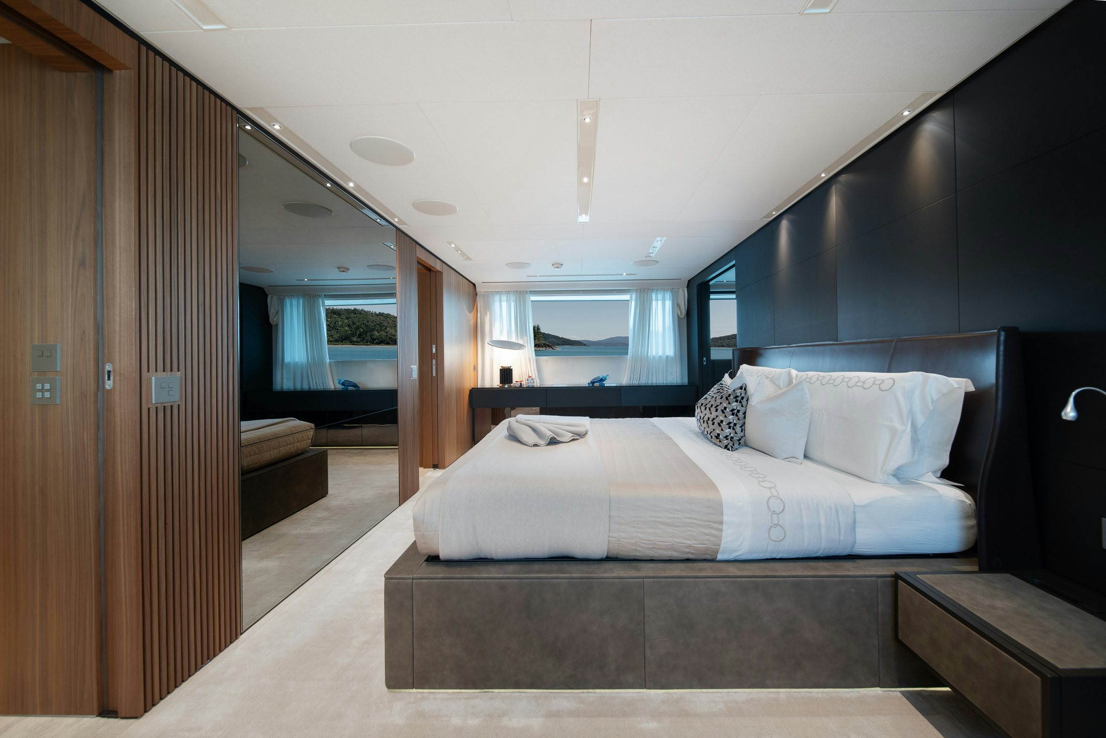 a bed in a room aboard AIX Yacht for Charter