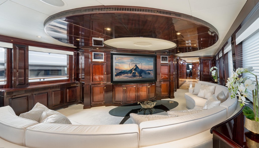 a living room with a large television aboard IONIAN PRINCESS Yacht for Sale