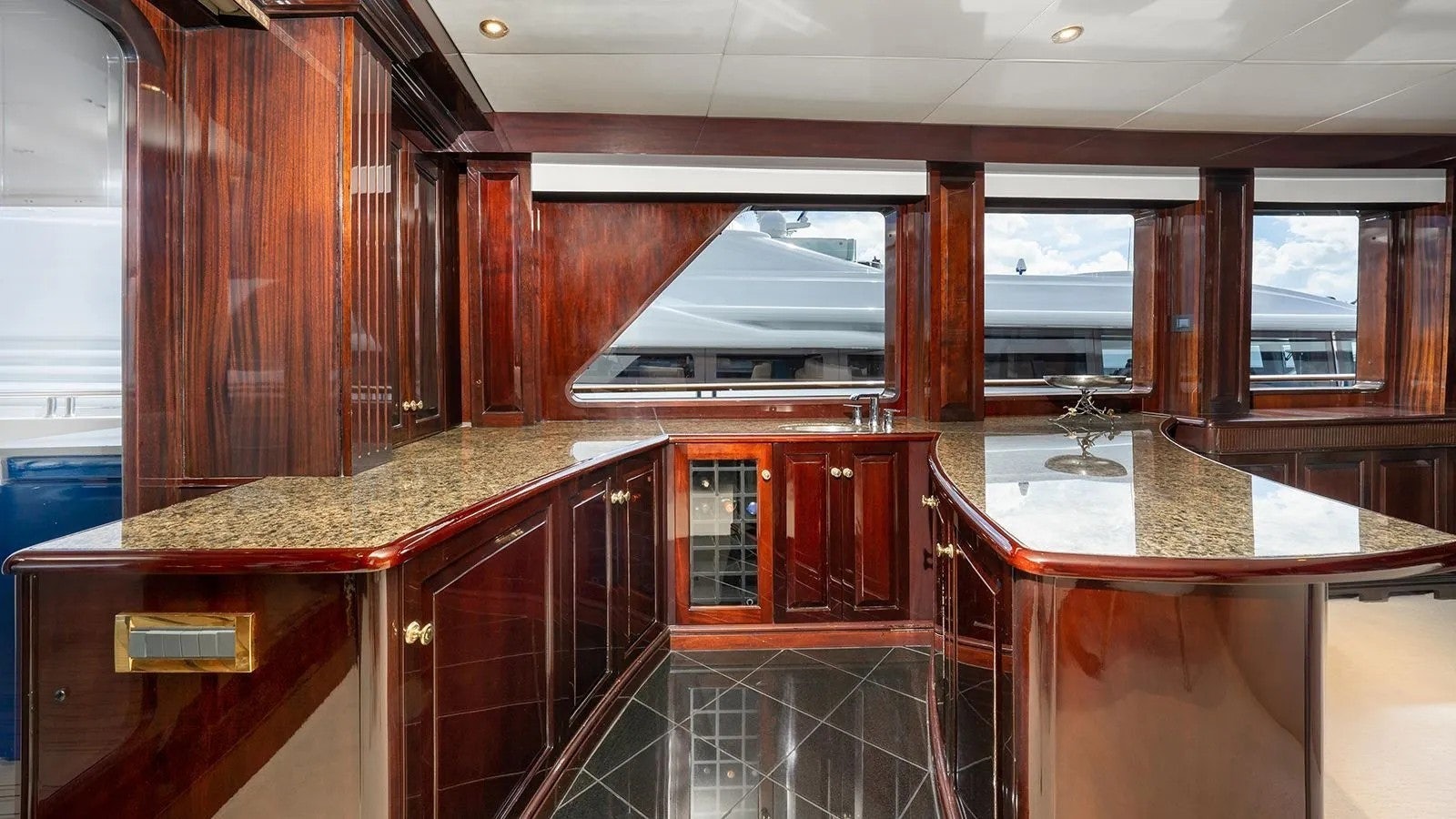 a kitchen with wooden cabinets aboard IONIAN PRINCESS Yacht for Sale