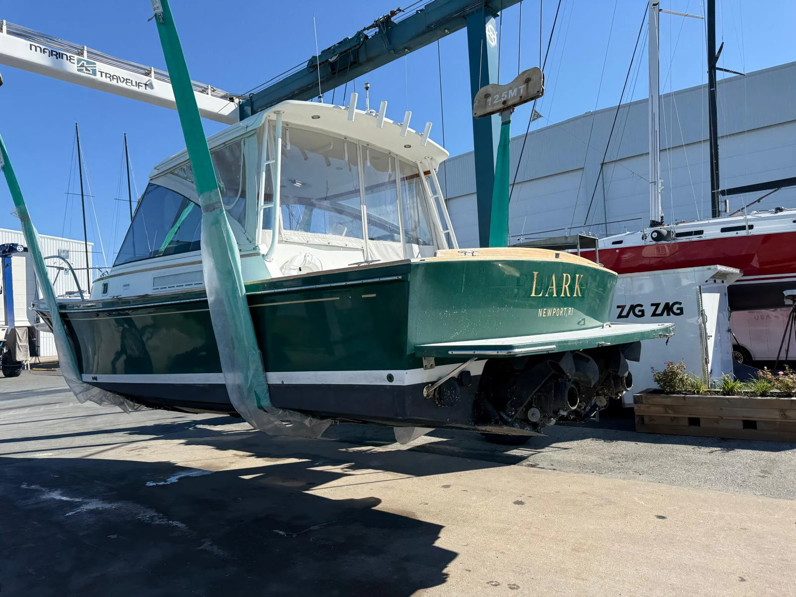 a boat on a trailer aboard LARK Yacht for Sale