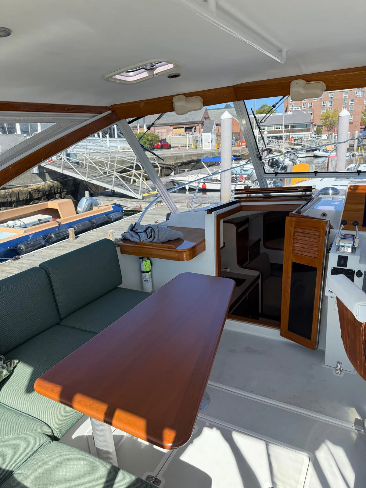 a room with a couch and a table with chairs aboard LARK Yacht for Sale