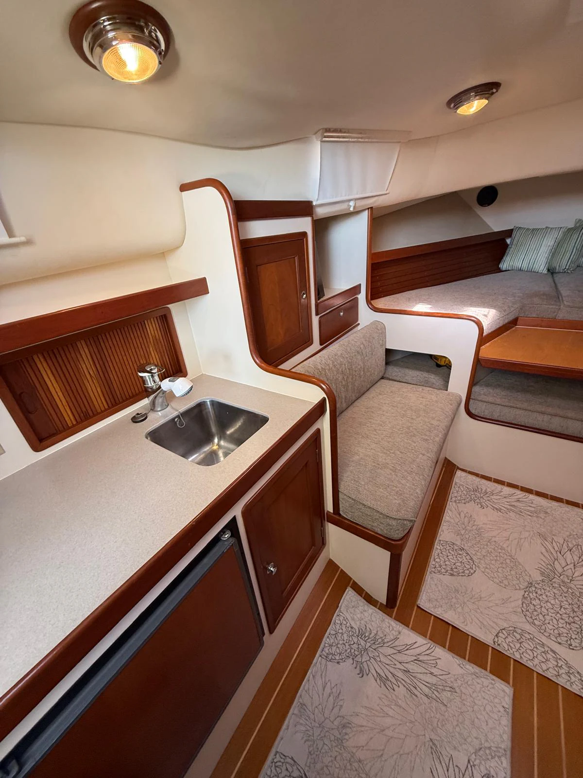 a small kitchen with a sink aboard LARK Yacht for Sale