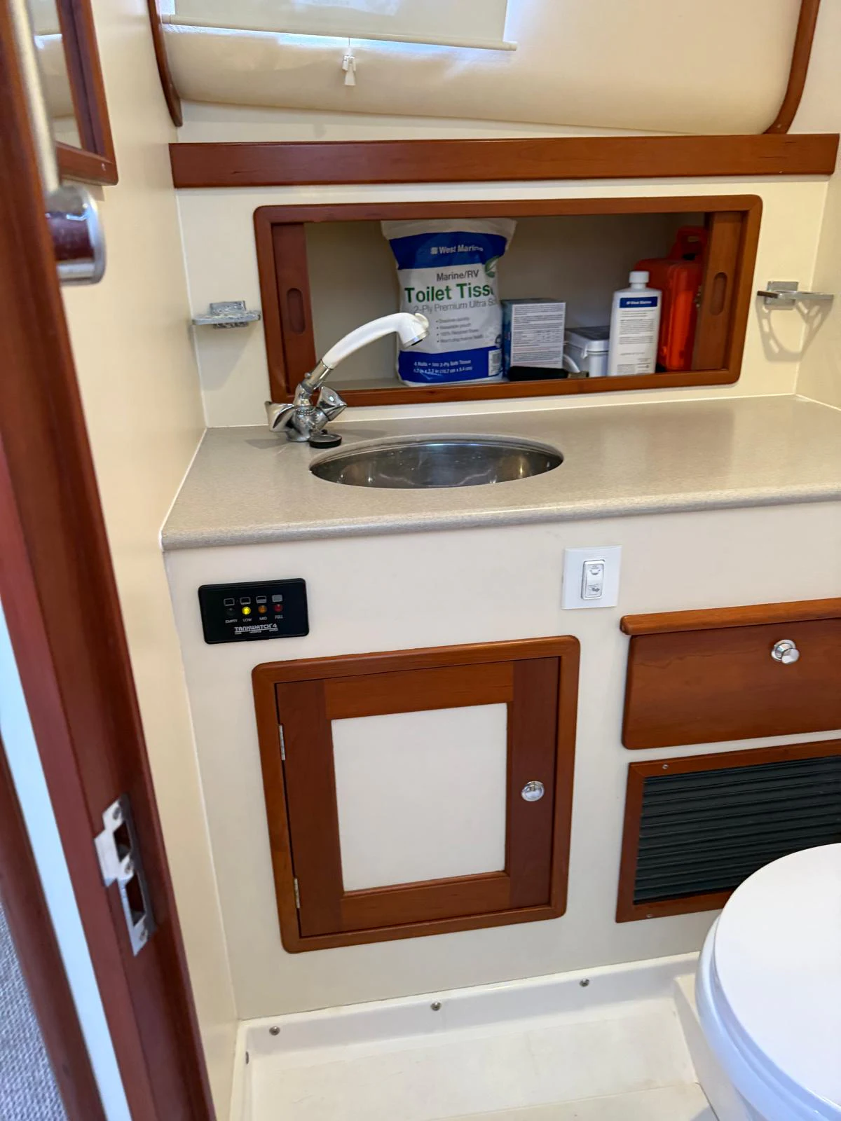 a sink with a shelf above it aboard LARK Yacht for Sale