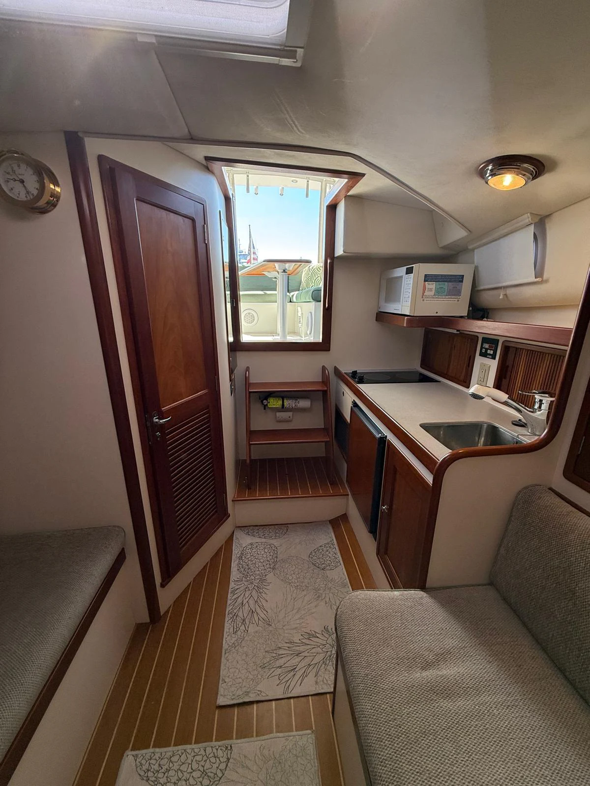 a kitchen with a sink and a microwave oven aboard LARK Yacht for Sale