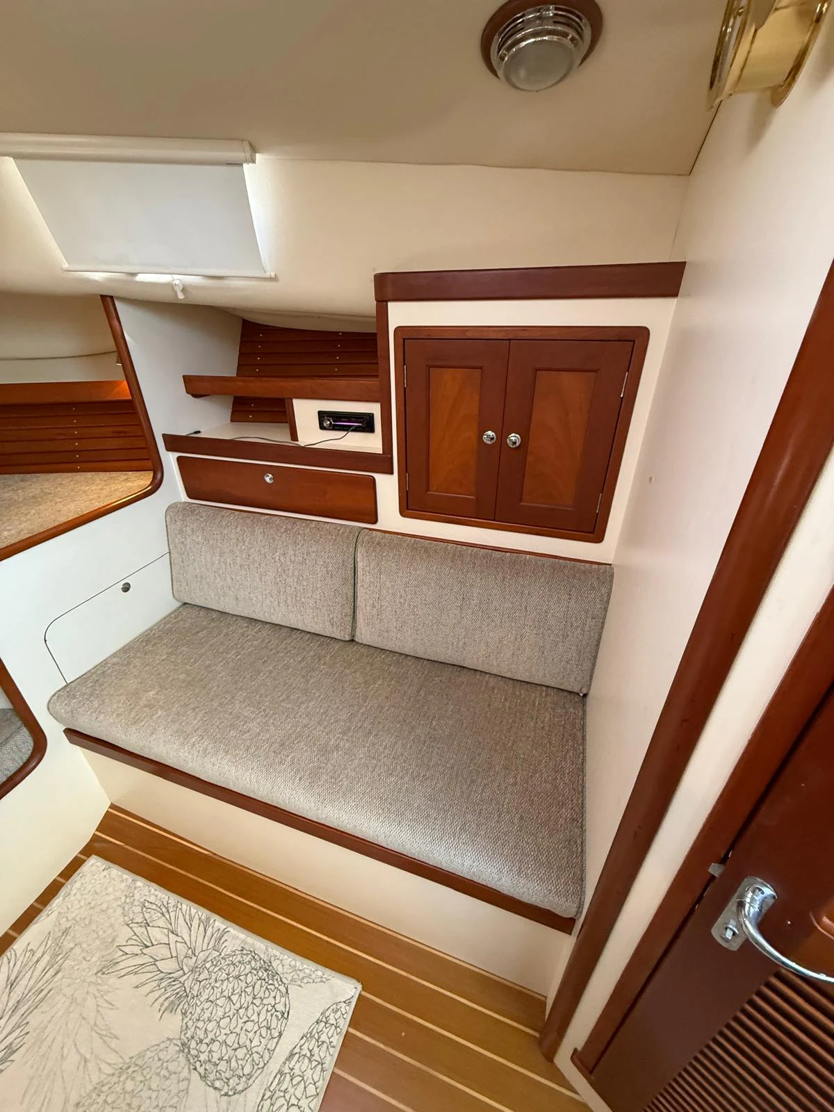 a room with a couch and a table aboard LARK Yacht for Sale