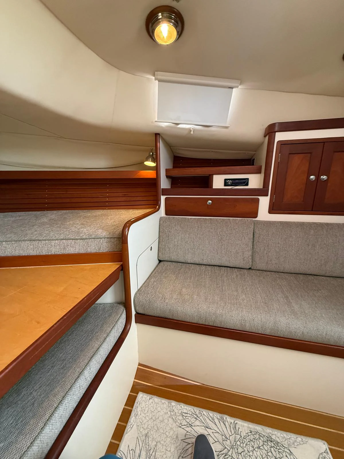 a room with a couch and a table aboard LARK Yacht for Sale