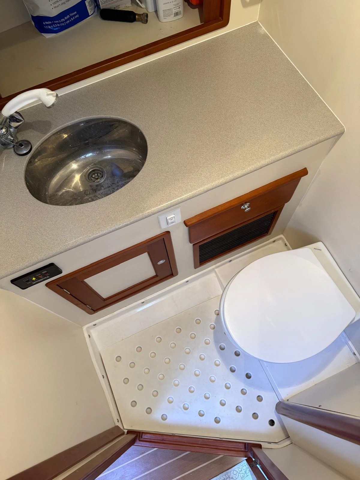 a sink and a toilet in a bathroom aboard LARK Yacht for Sale