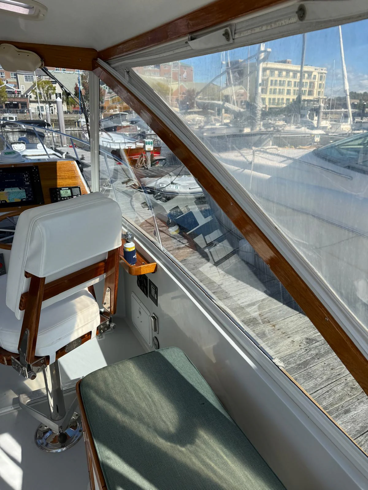 a room with a window and a view of a city aboard LARK Yacht for Sale