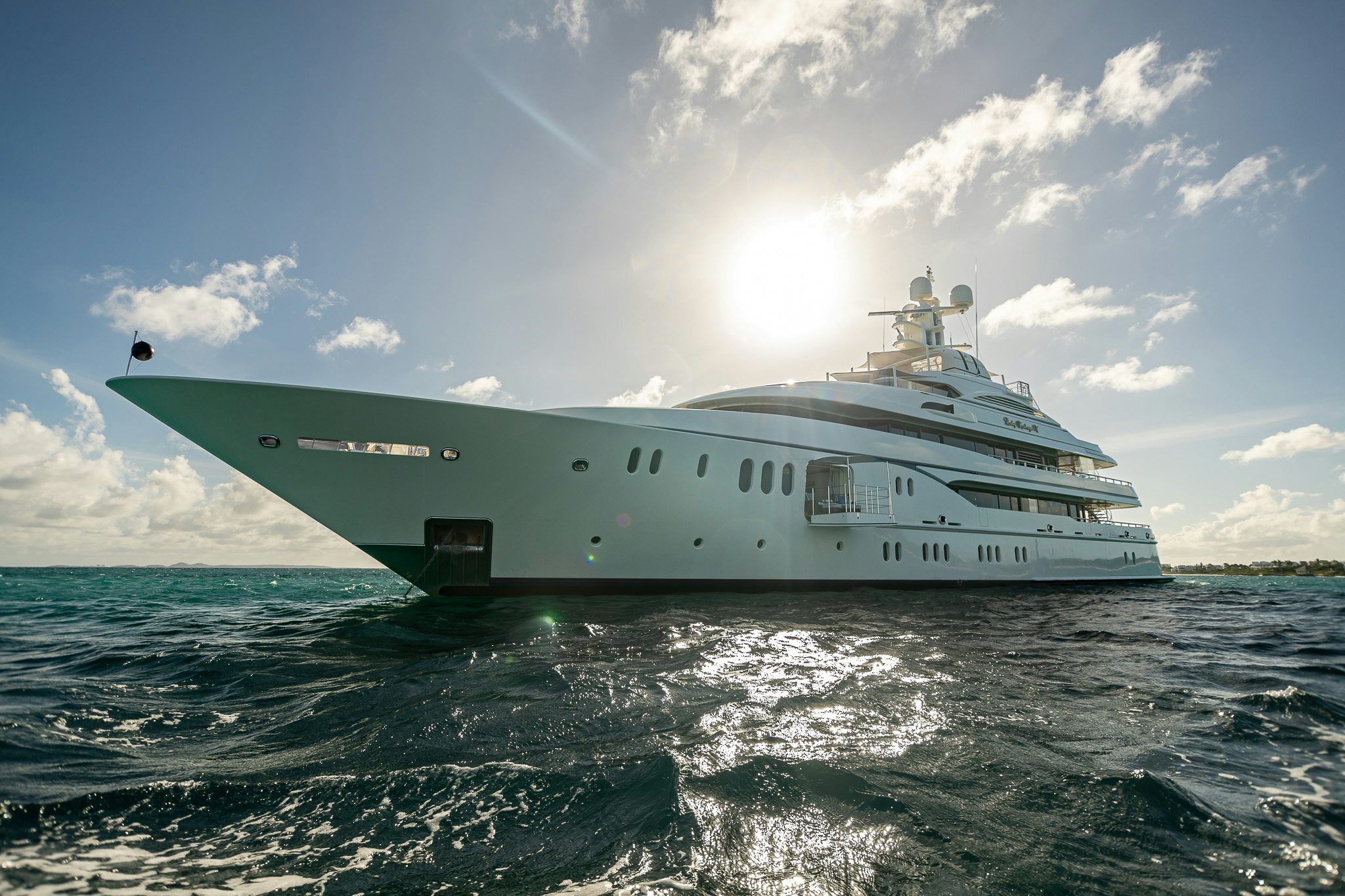 a large white ship in the water aboard LADY KATHRYN V Yacht for Charter