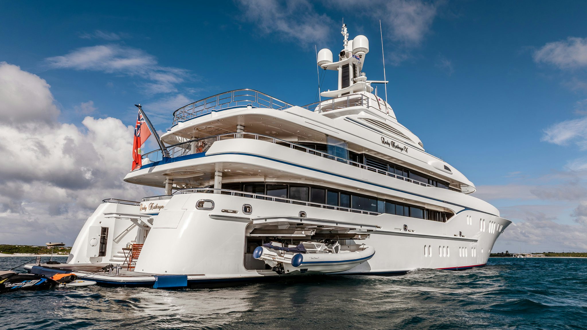 a large white boat on the water aboard LADY KATHRYN V Yacht for Charter