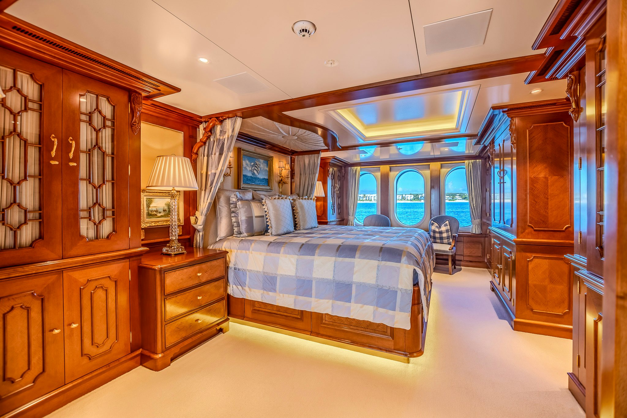 a bedroom with a bed and a desk aboard LADY KATHRYN V Yacht for Charter