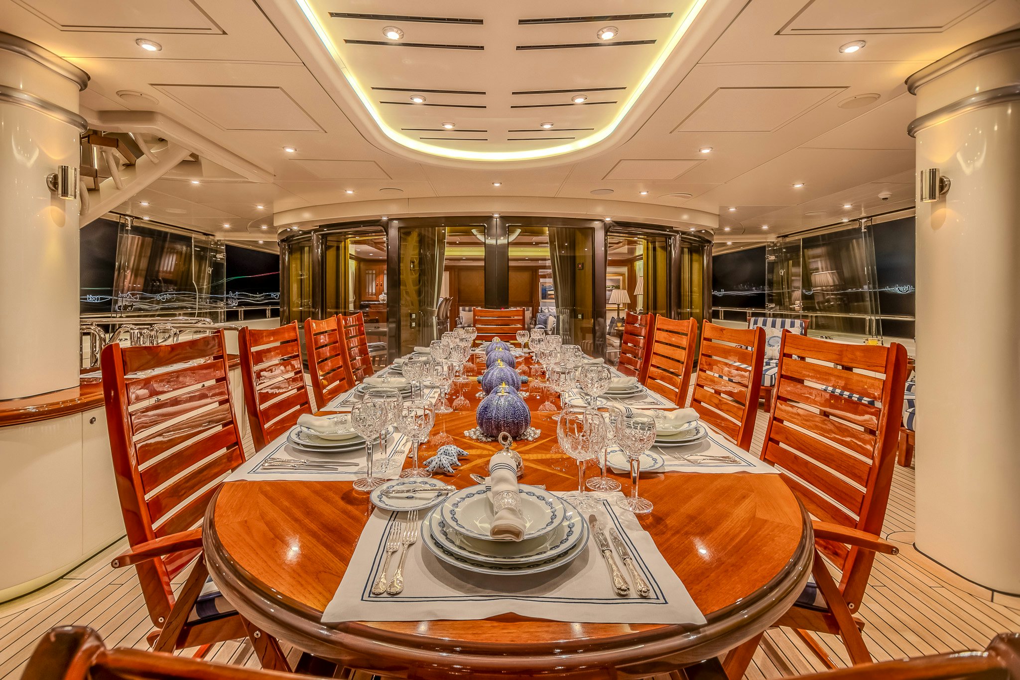a large dining room with a large table and chairs aboard LADY KATHRYN V Yacht for Charter