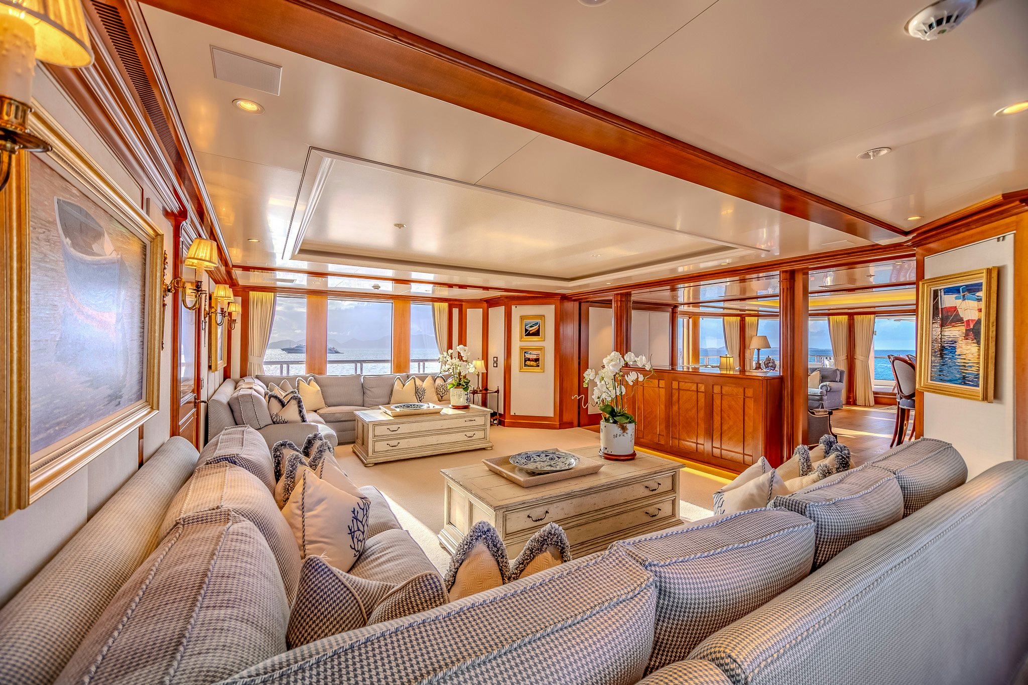 a living room with a large window aboard LADY KATHRYN V Yacht for Charter