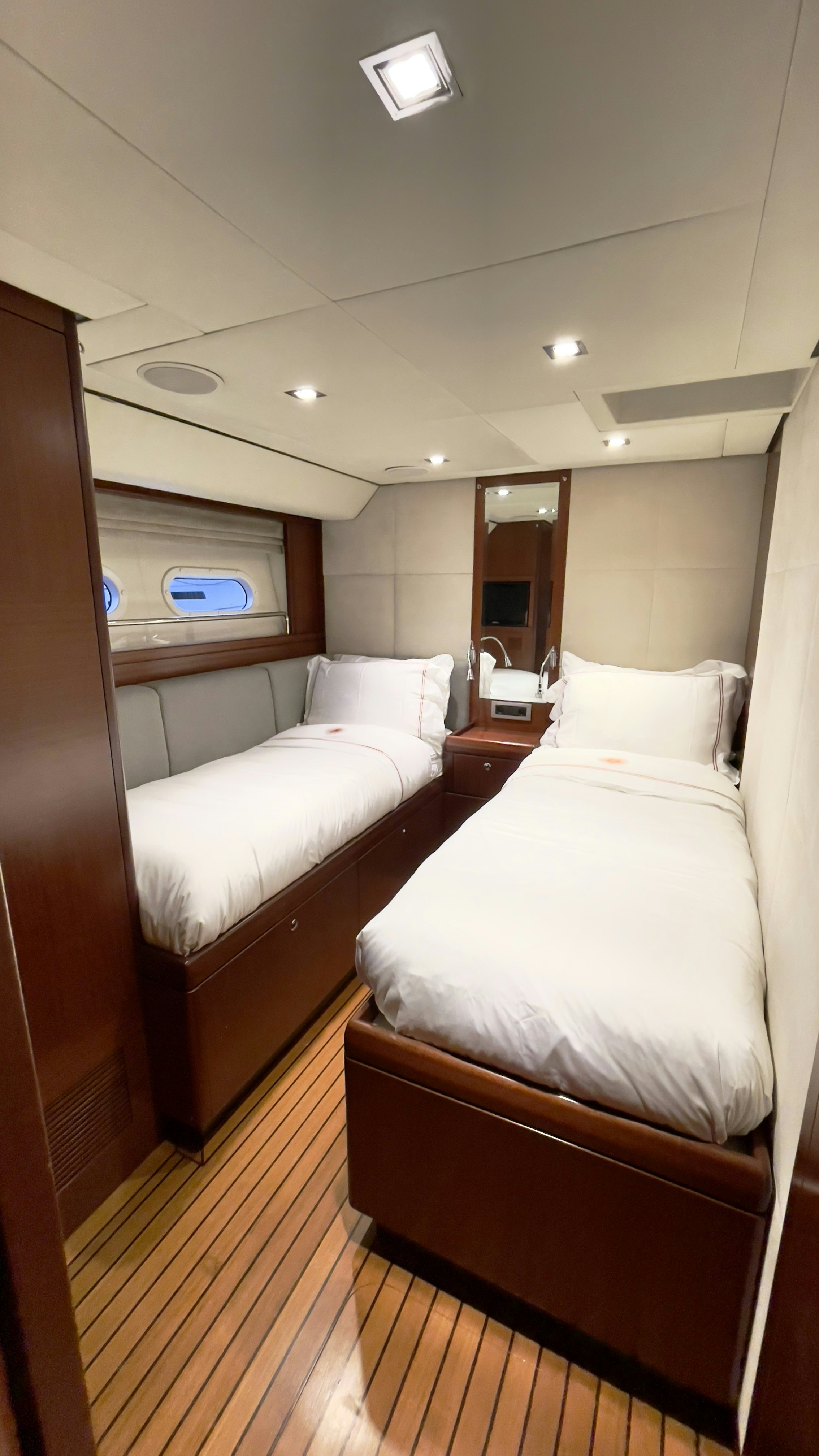 a couple of beds in a hotel room aboard ASSAI Yacht for Sale