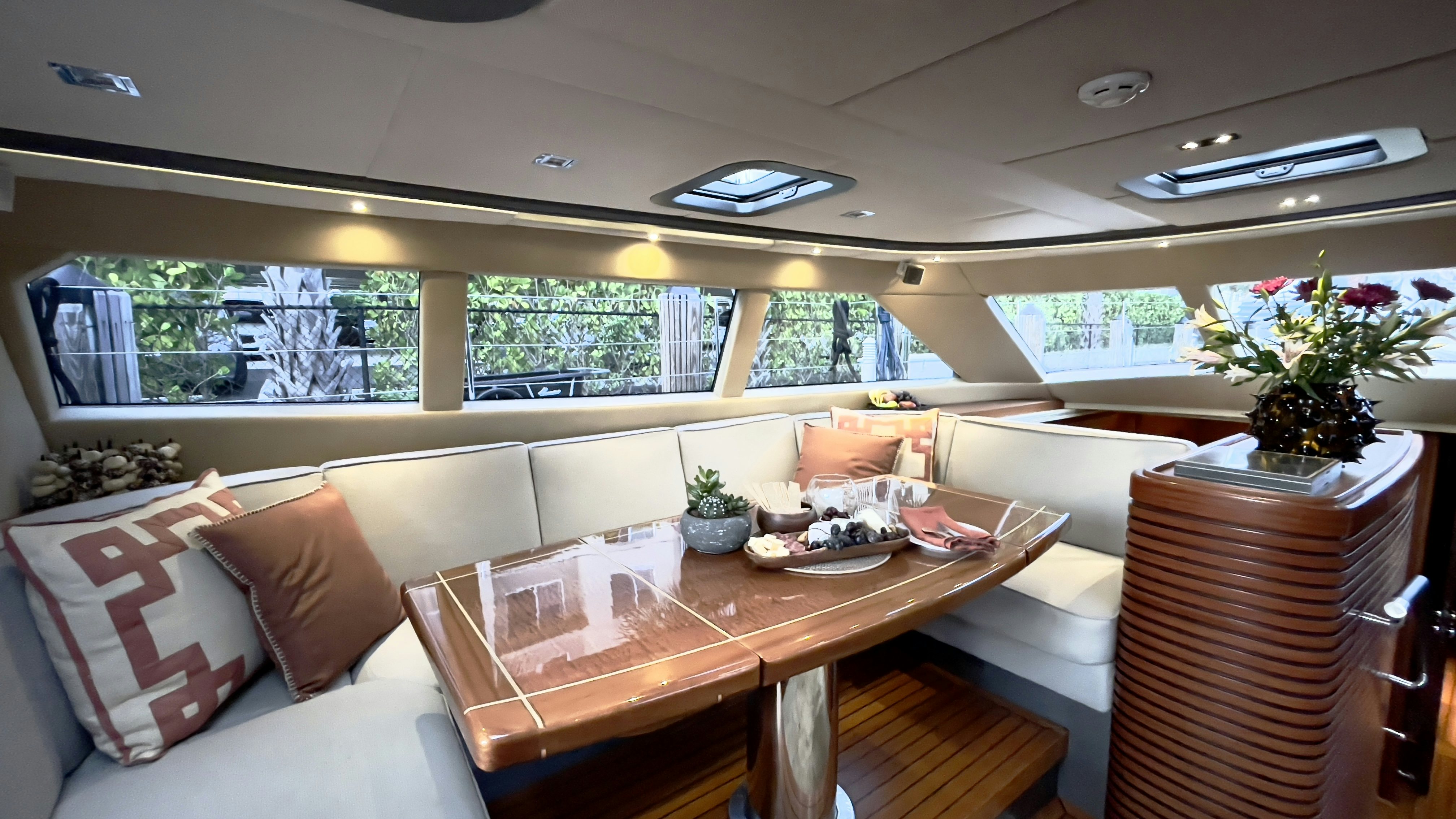 a room with a table and chairs aboard ASSAI Yacht for Sale