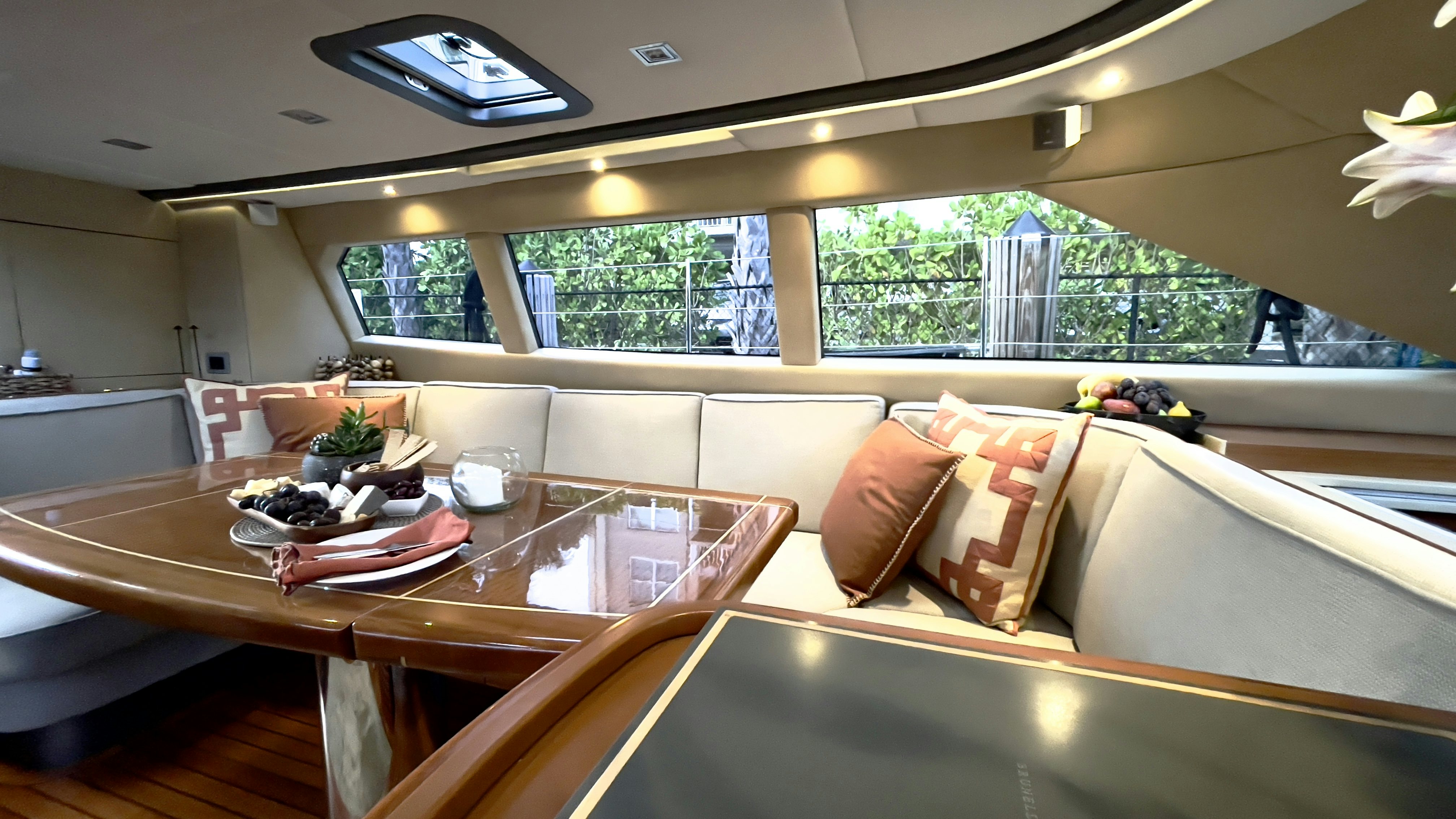 a room with a table and chairs aboard ASSAI Yacht for Sale