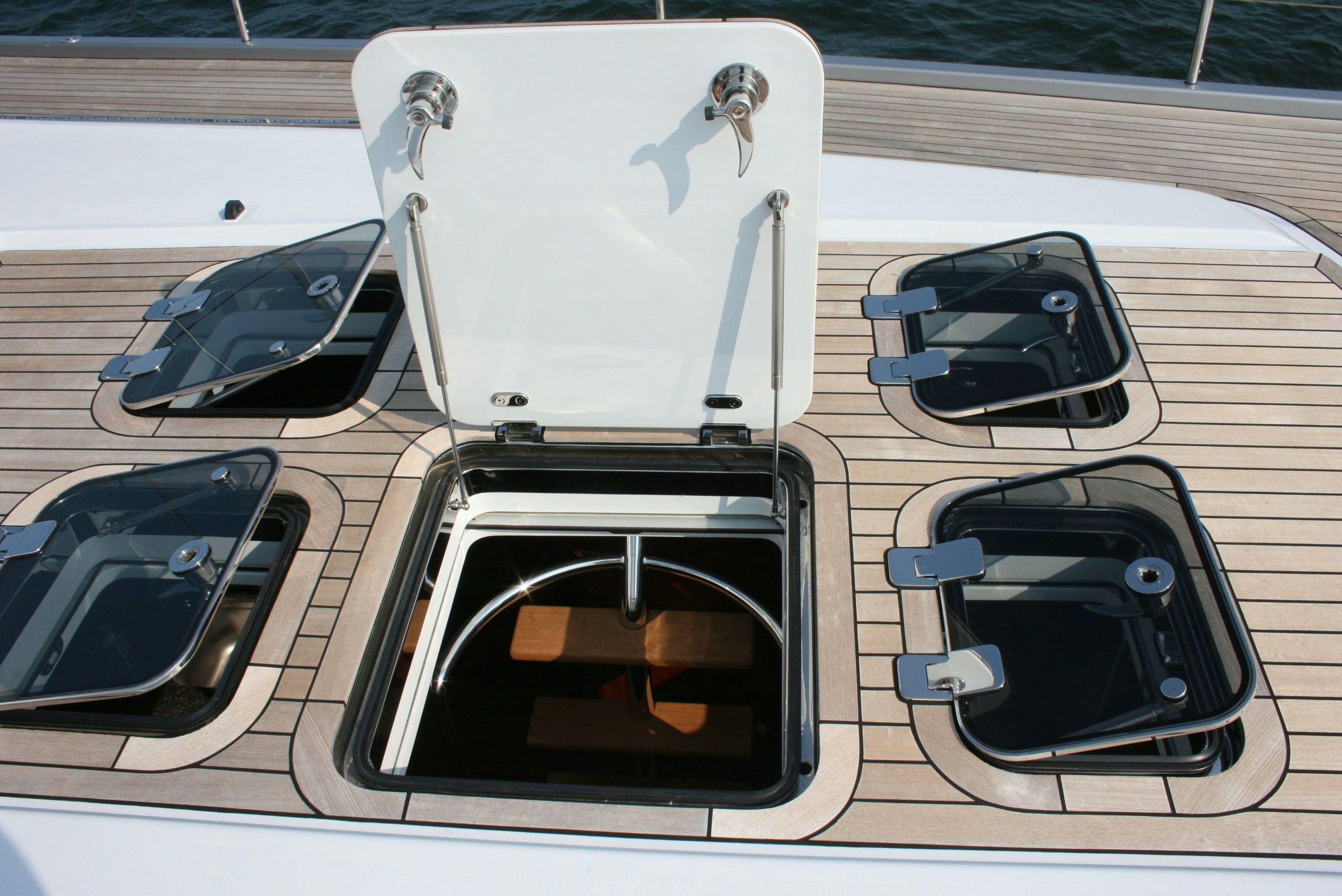 a car with its doors open aboard ASSAI Yacht for Sale