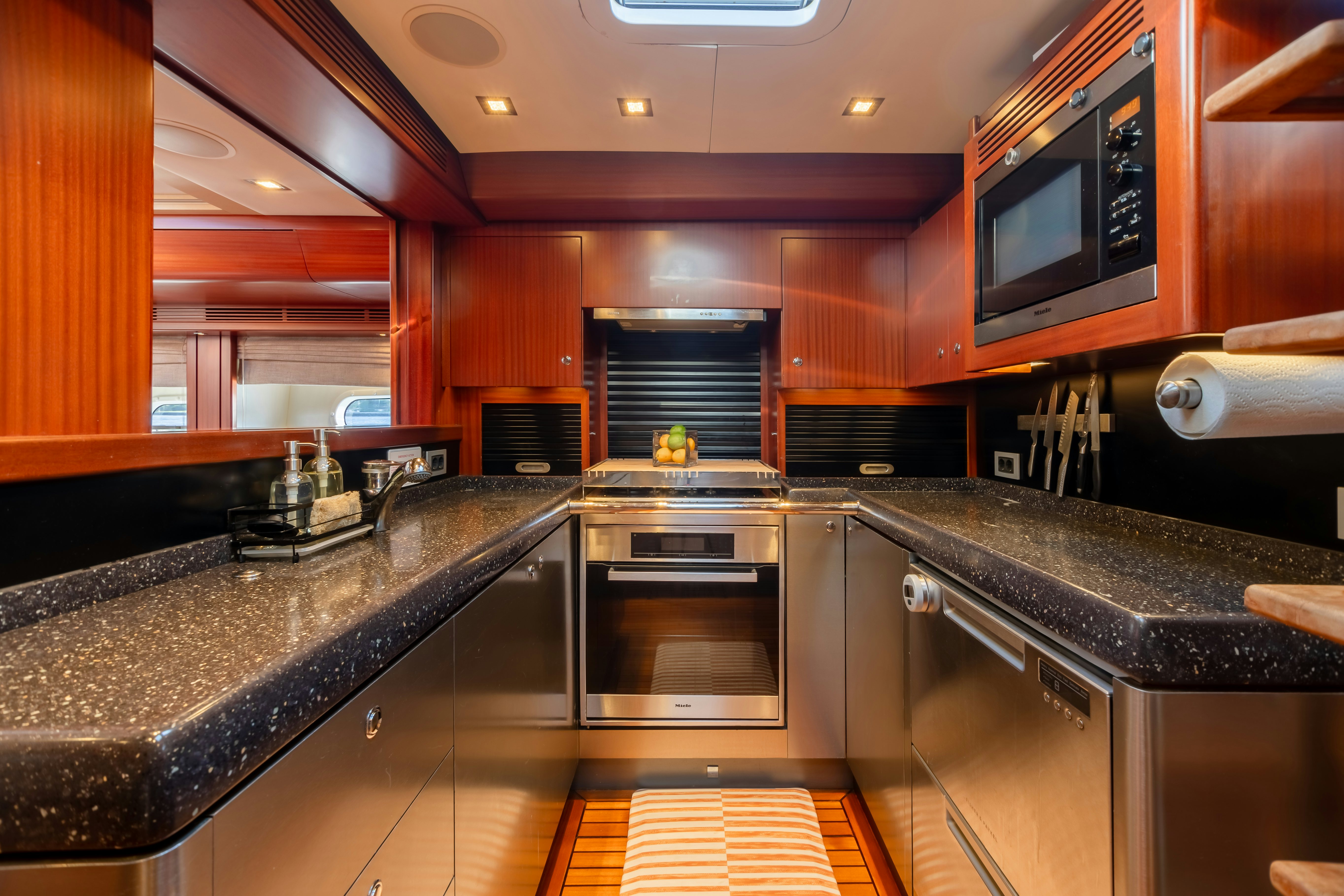 a kitchen with stainless steel appliances aboard ASSAI Yacht for Sale