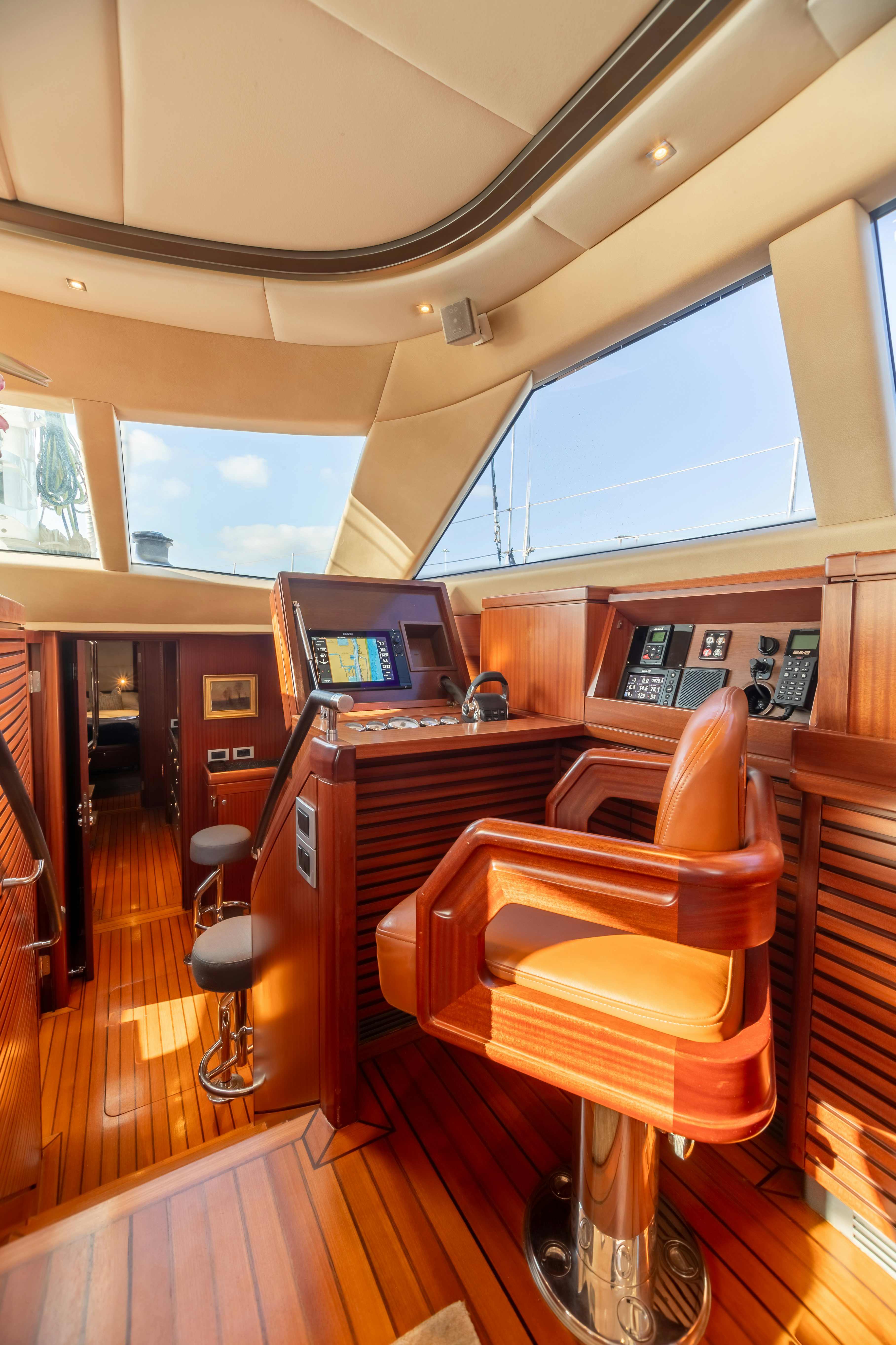a room with a desk and chairs aboard ASSAI Yacht for Sale