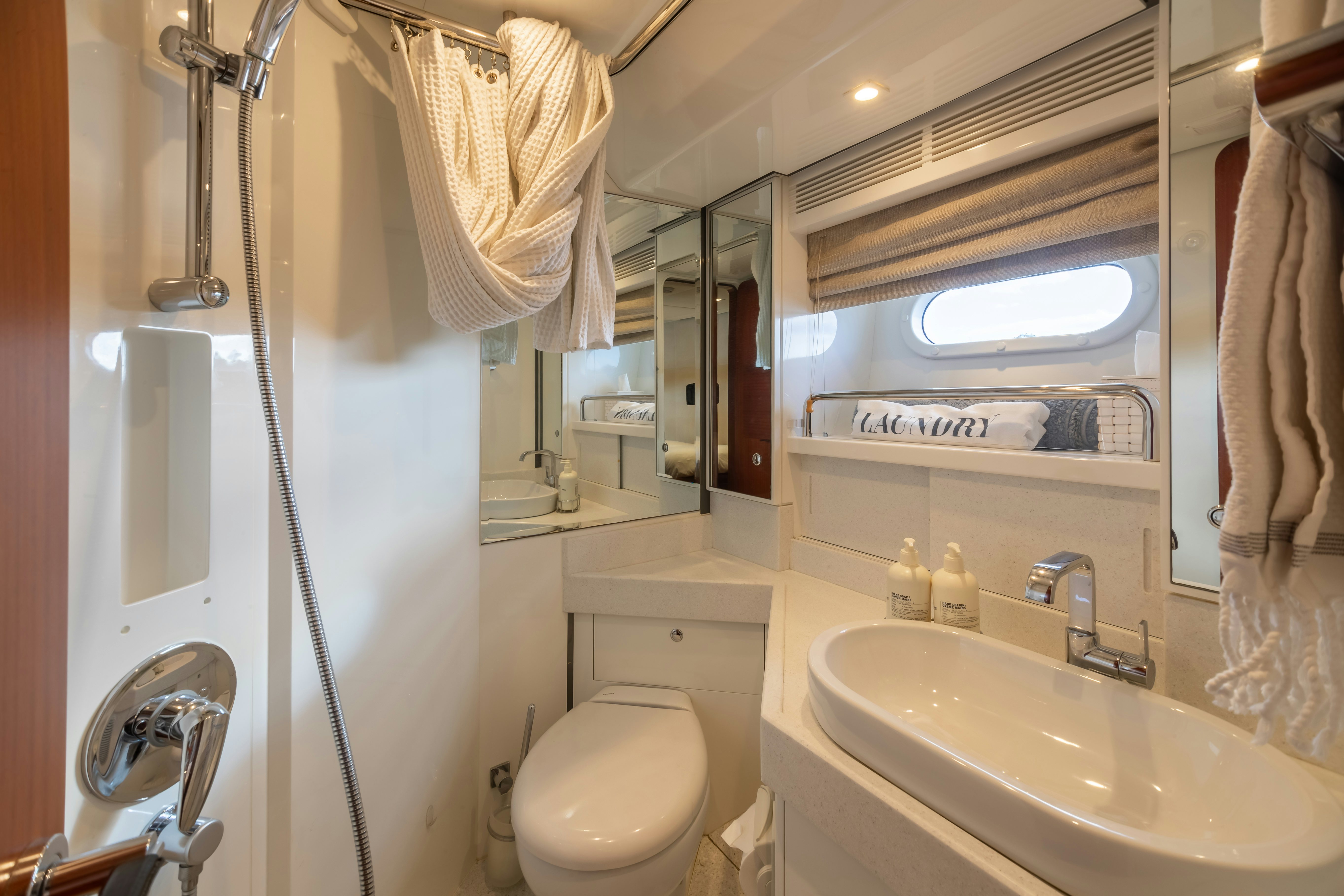 a bathroom with a sink and a toilet aboard ASSAI Yacht for Sale
