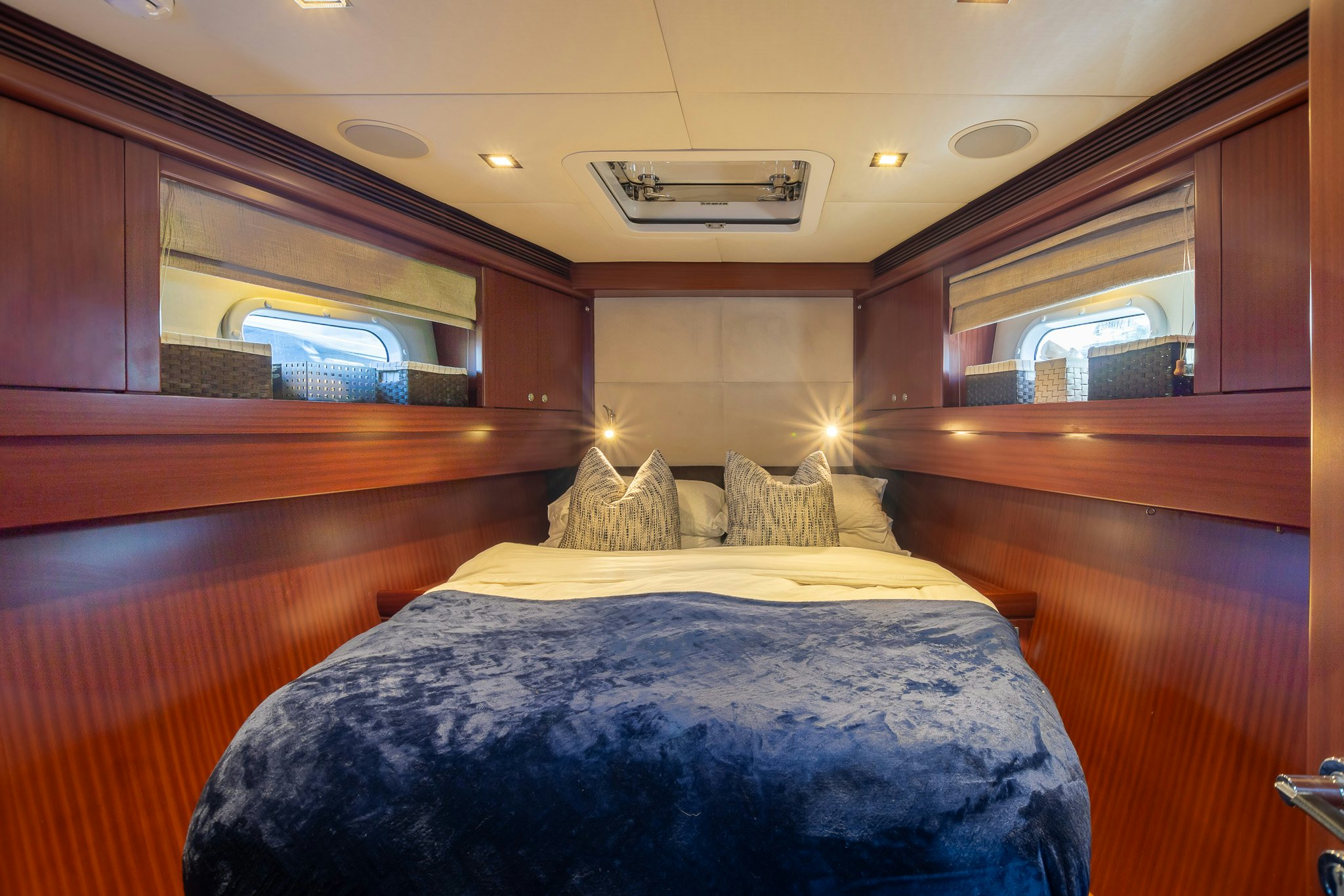 a room with a bed and a window aboard ASSAI Yacht for Sale