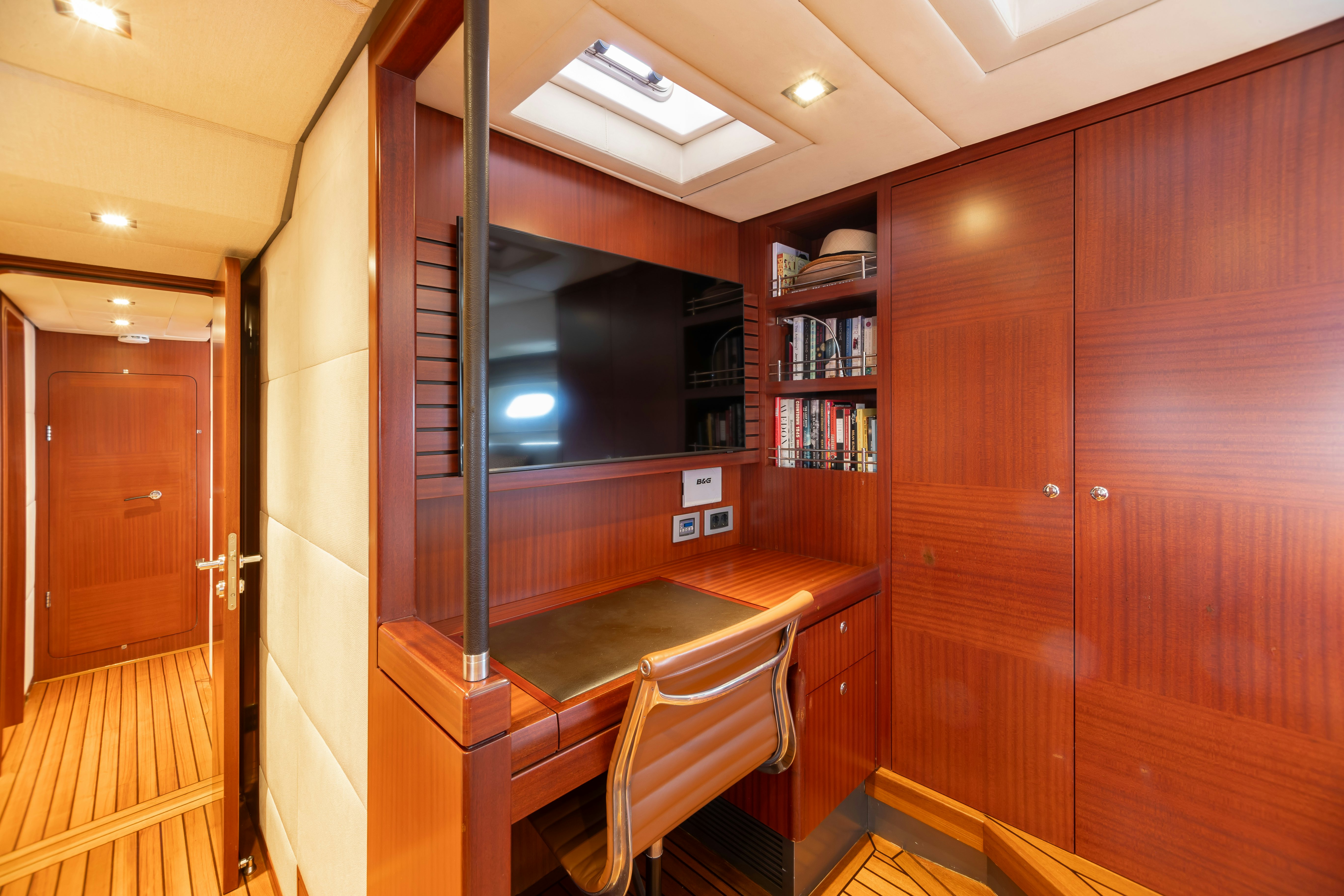 a room with a table and chairs aboard ASSAI Yacht for Sale