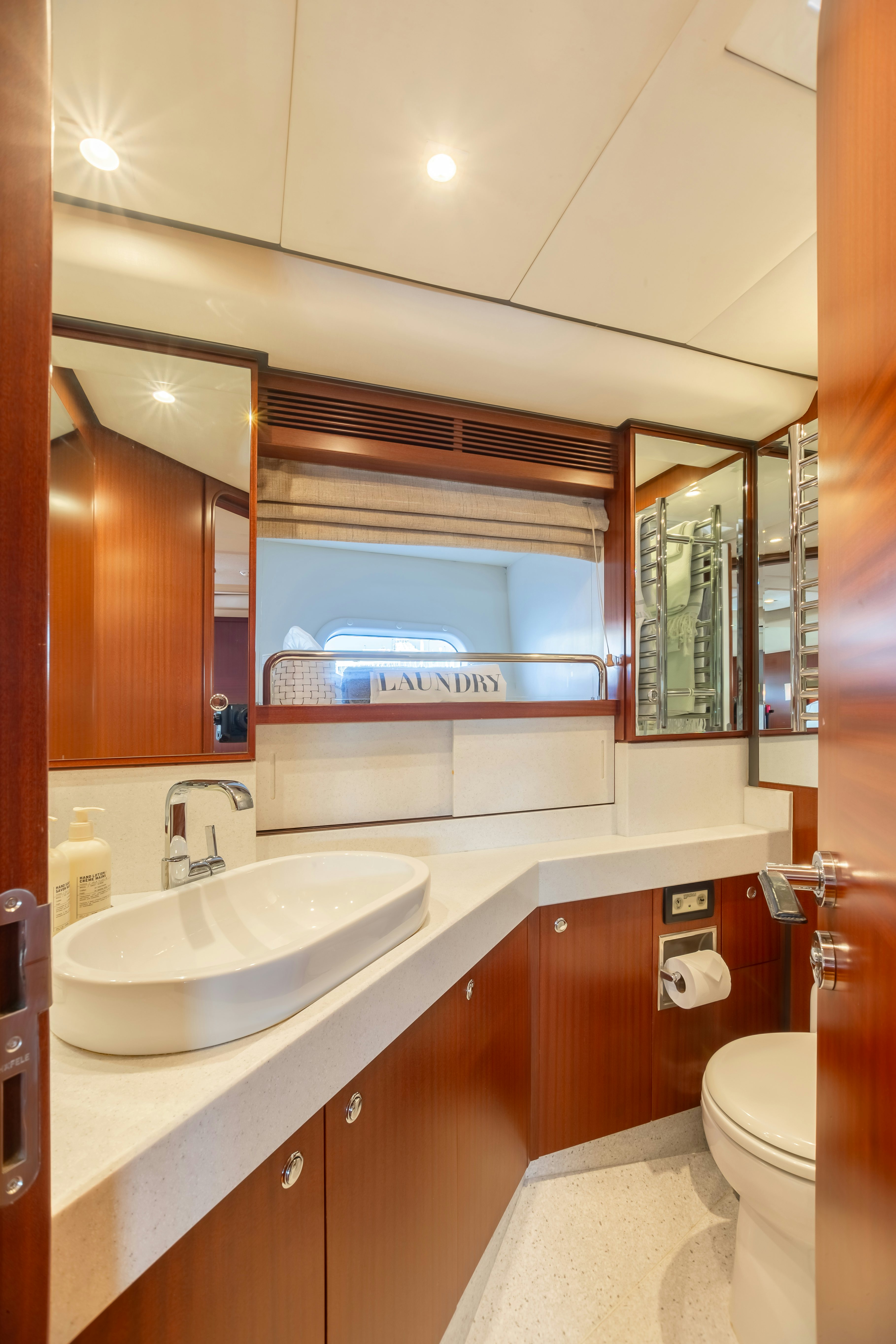 a bathroom with a sink and a mirror aboard ASSAI Yacht for Sale