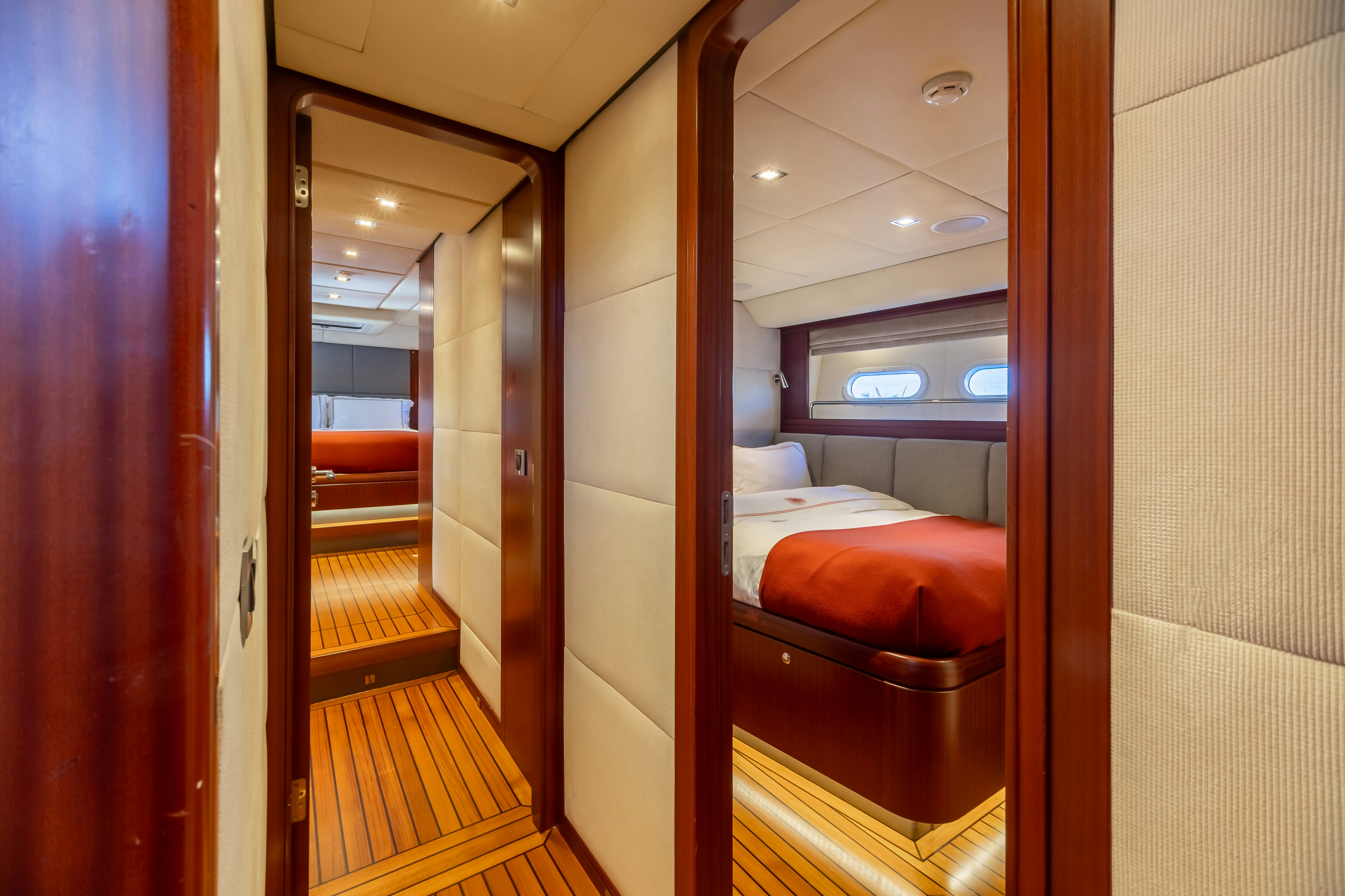 a room with a bed and a door aboard ASSAI Yacht for Sale