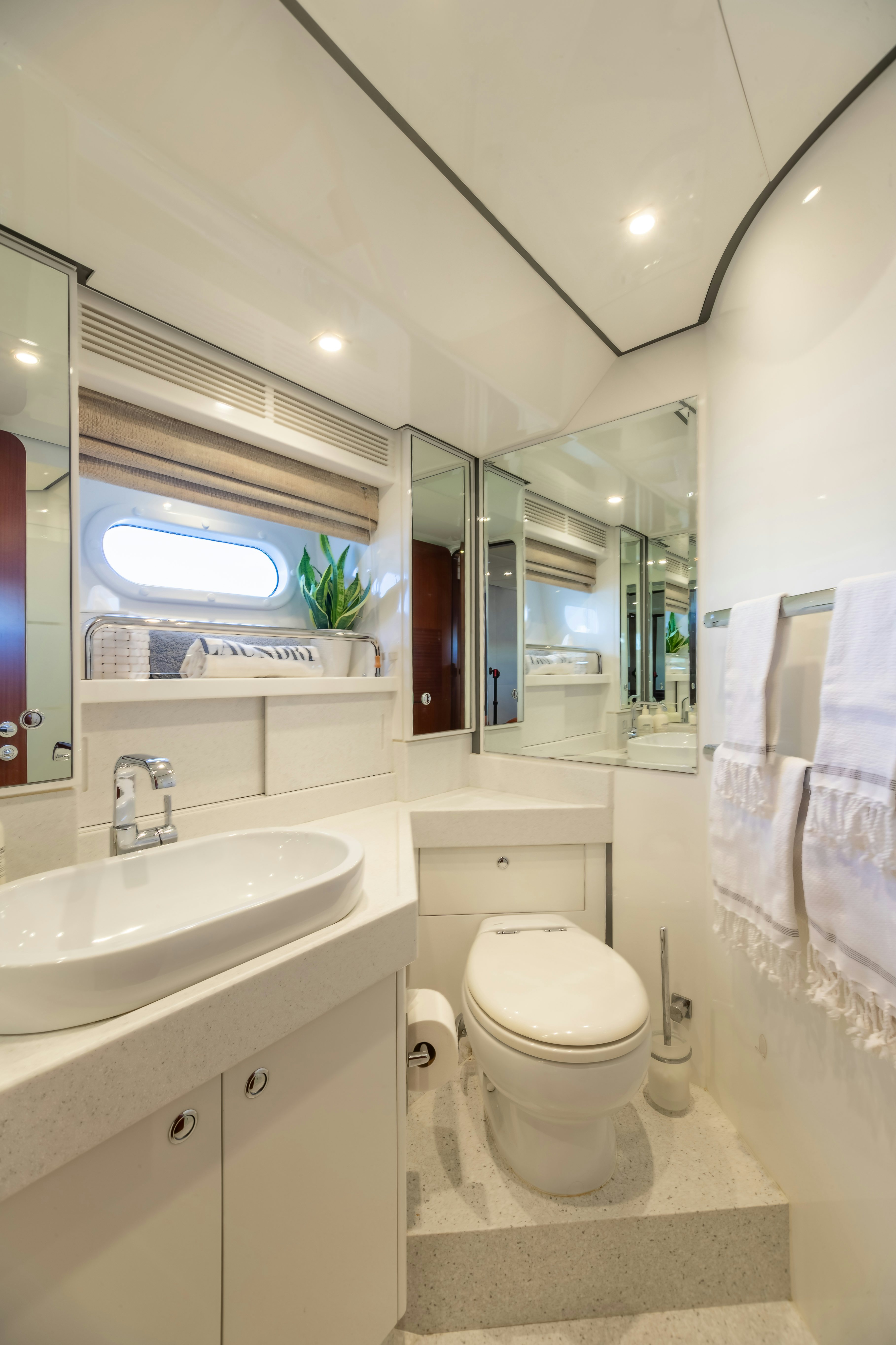 a bathroom with a sink and toilet aboard ASSAI Yacht for Sale