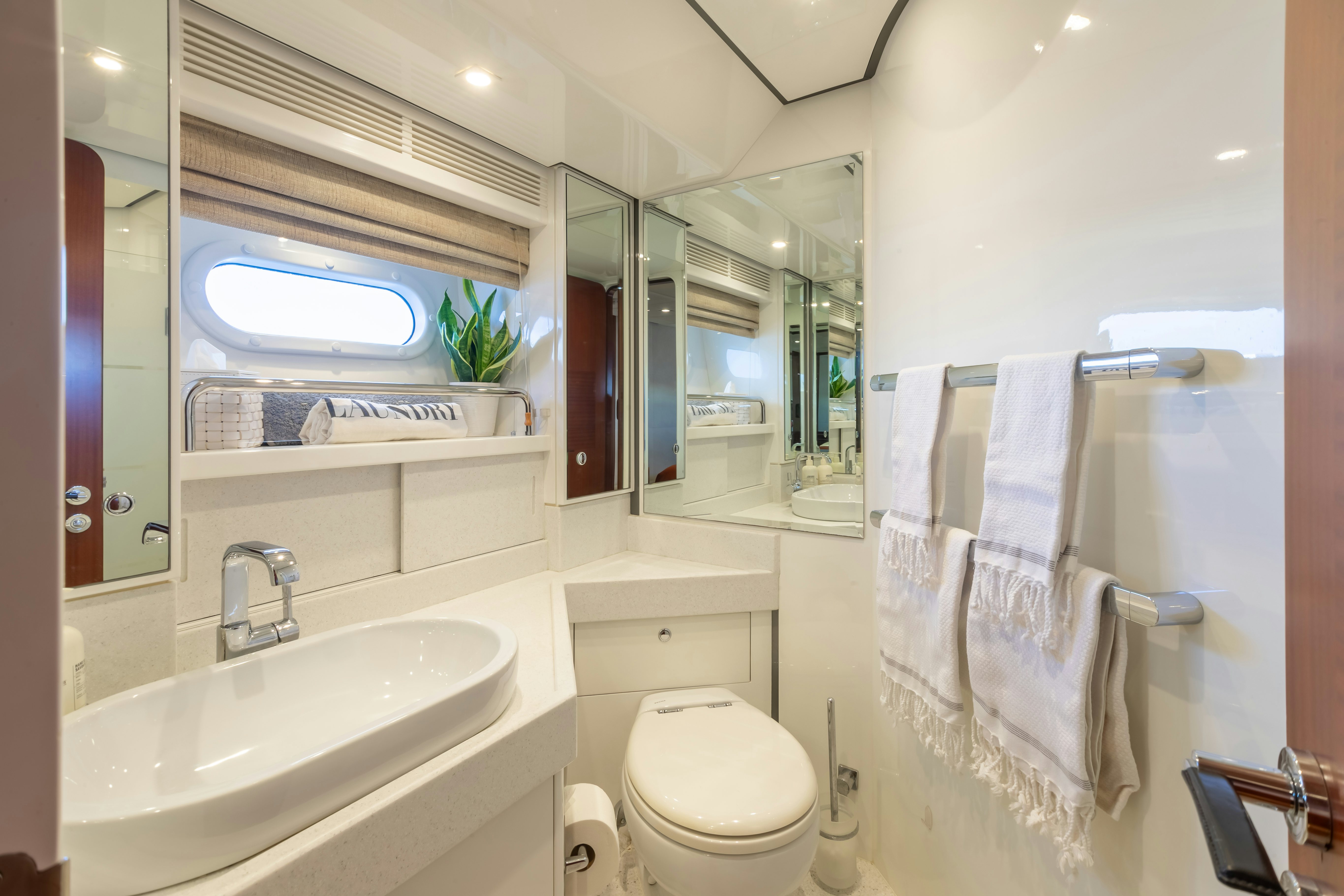 a bathroom with a sink and toilet aboard ASSAI Yacht for Sale