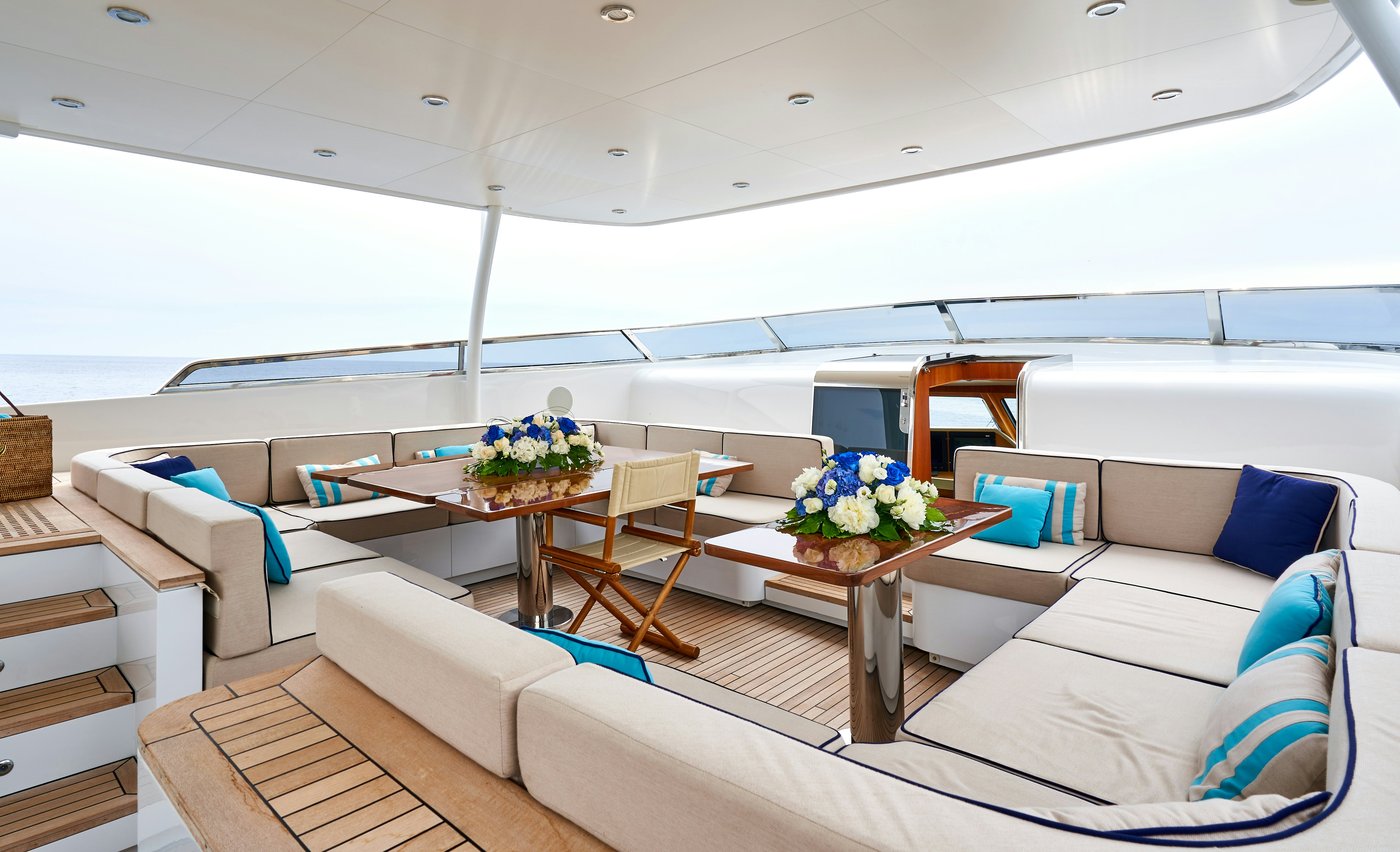 a living room with a couch and a table aboard L'INSTANT IV Yacht for Sale