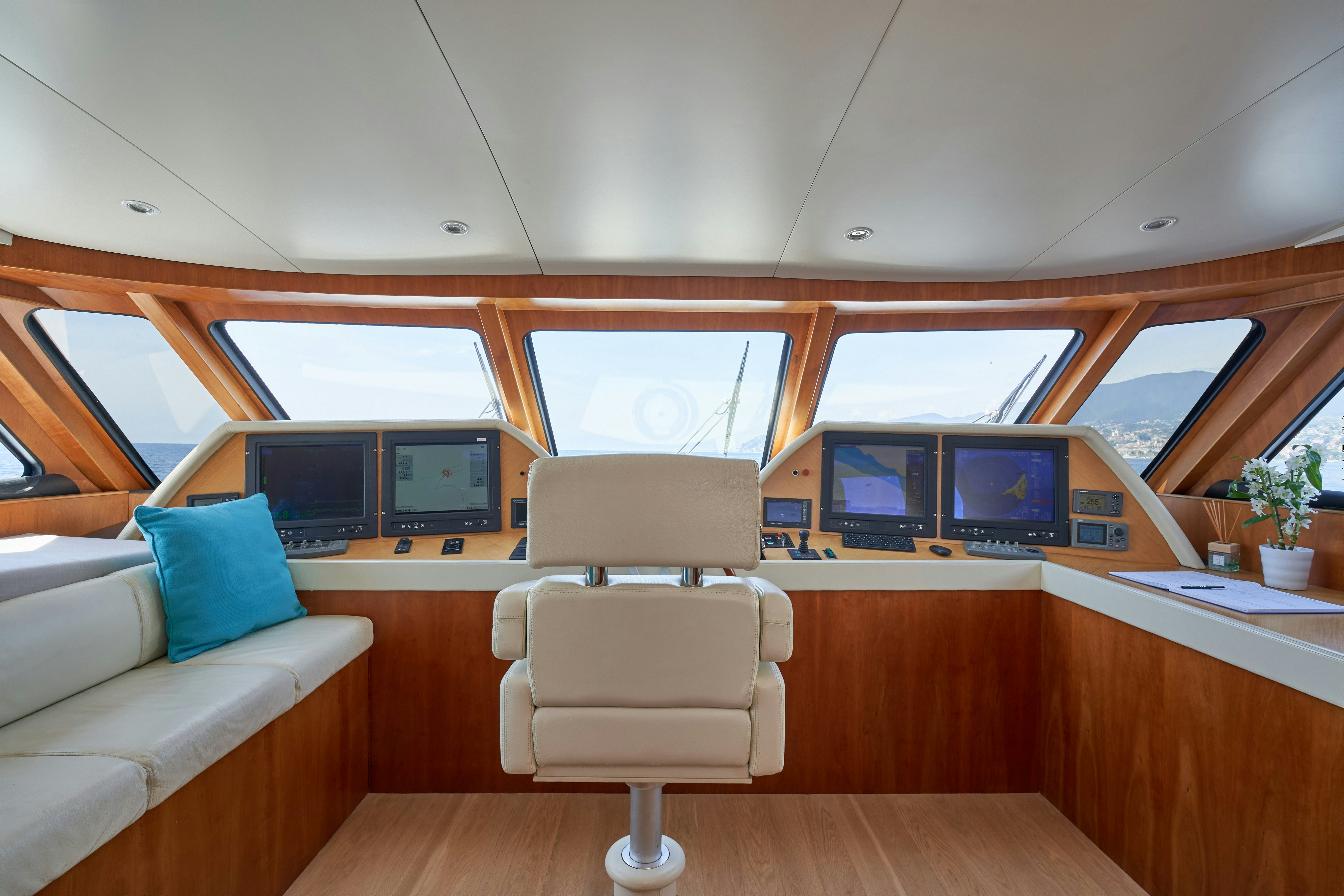 a room with a couch and a television aboard L'INSTANT IV Yacht for Sale