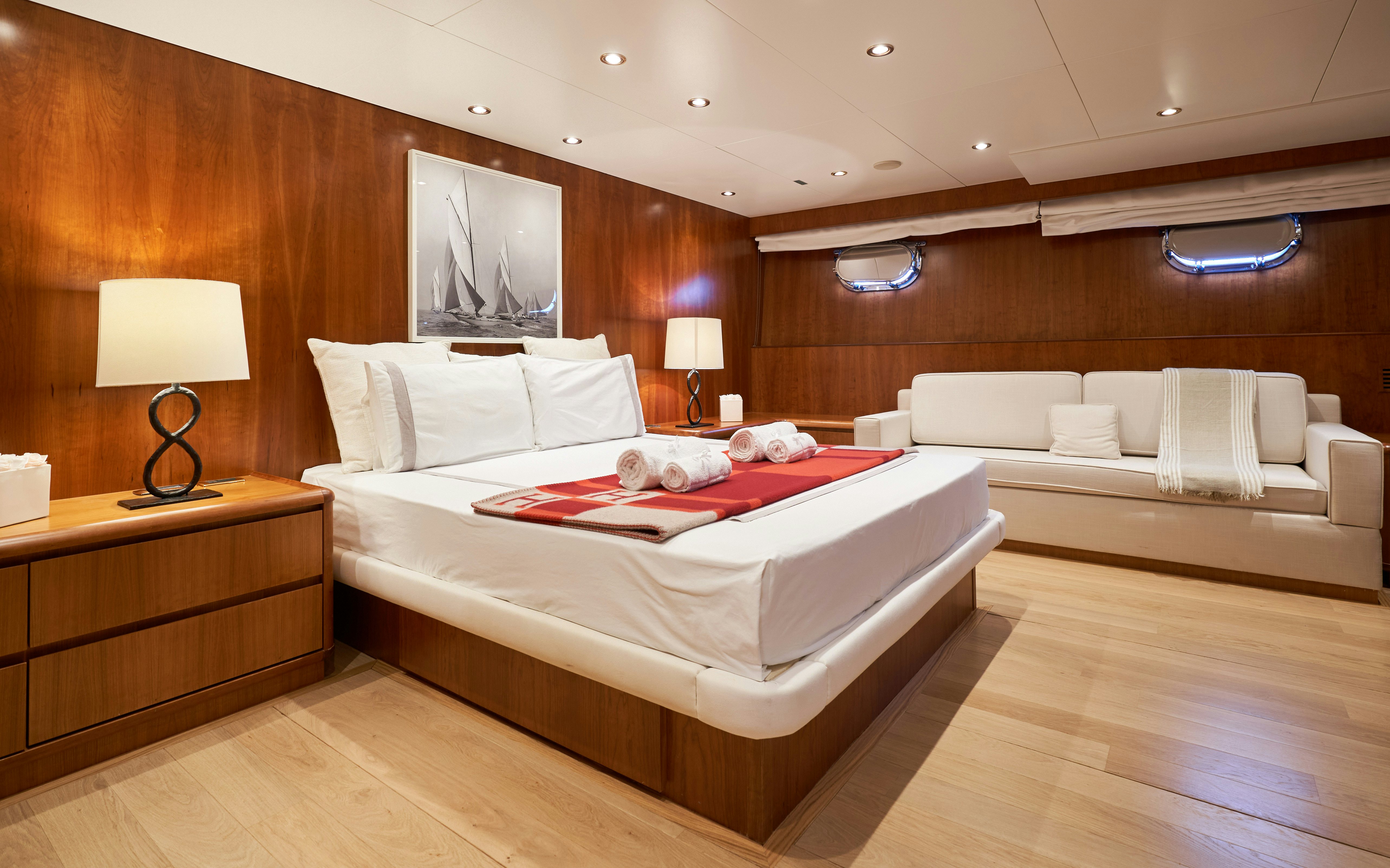 a hotel room with a bed and a television aboard L'INSTANT IV Yacht for Sale