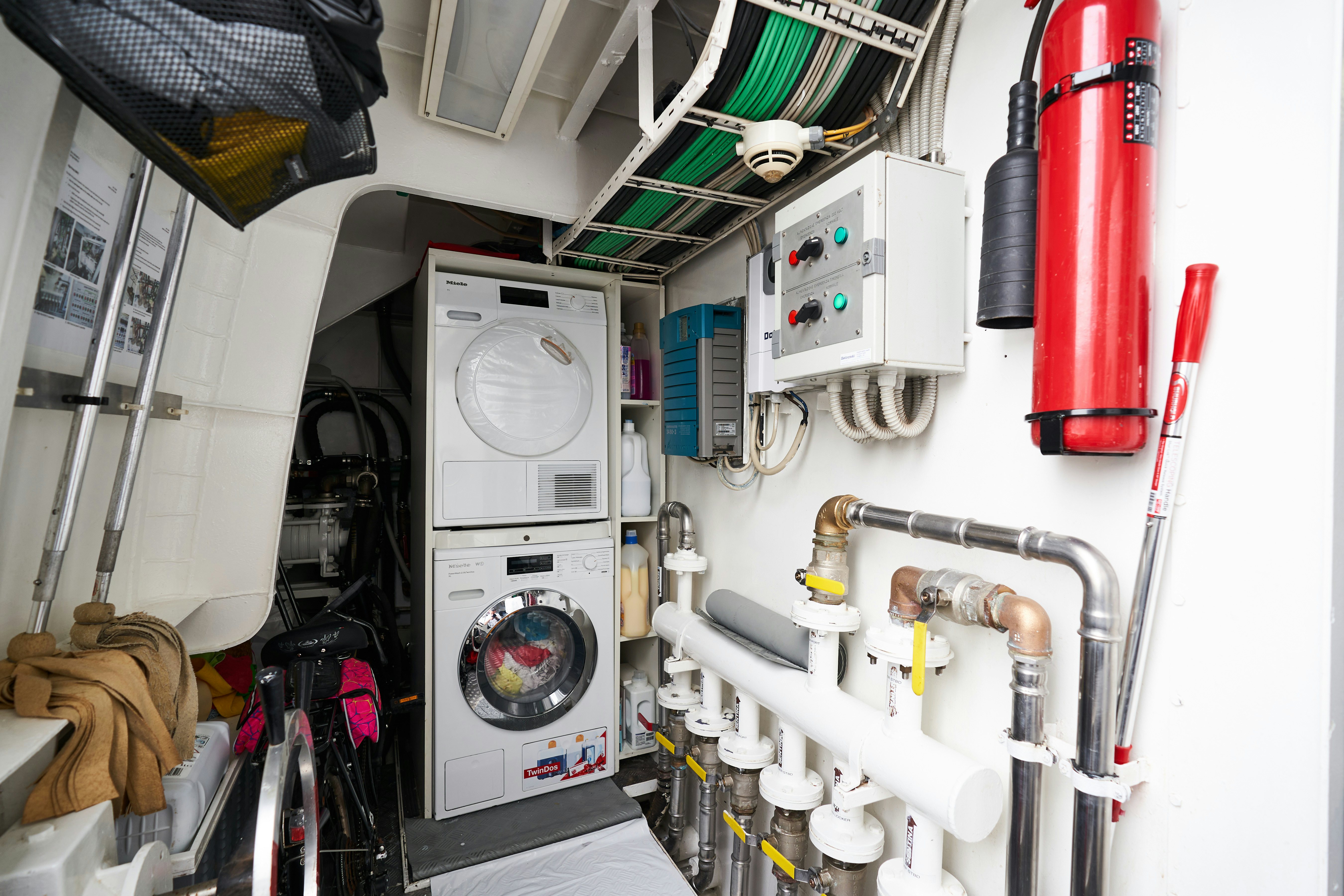 a room with machinery and equipment aboard L'INSTANT IV Yacht for Sale