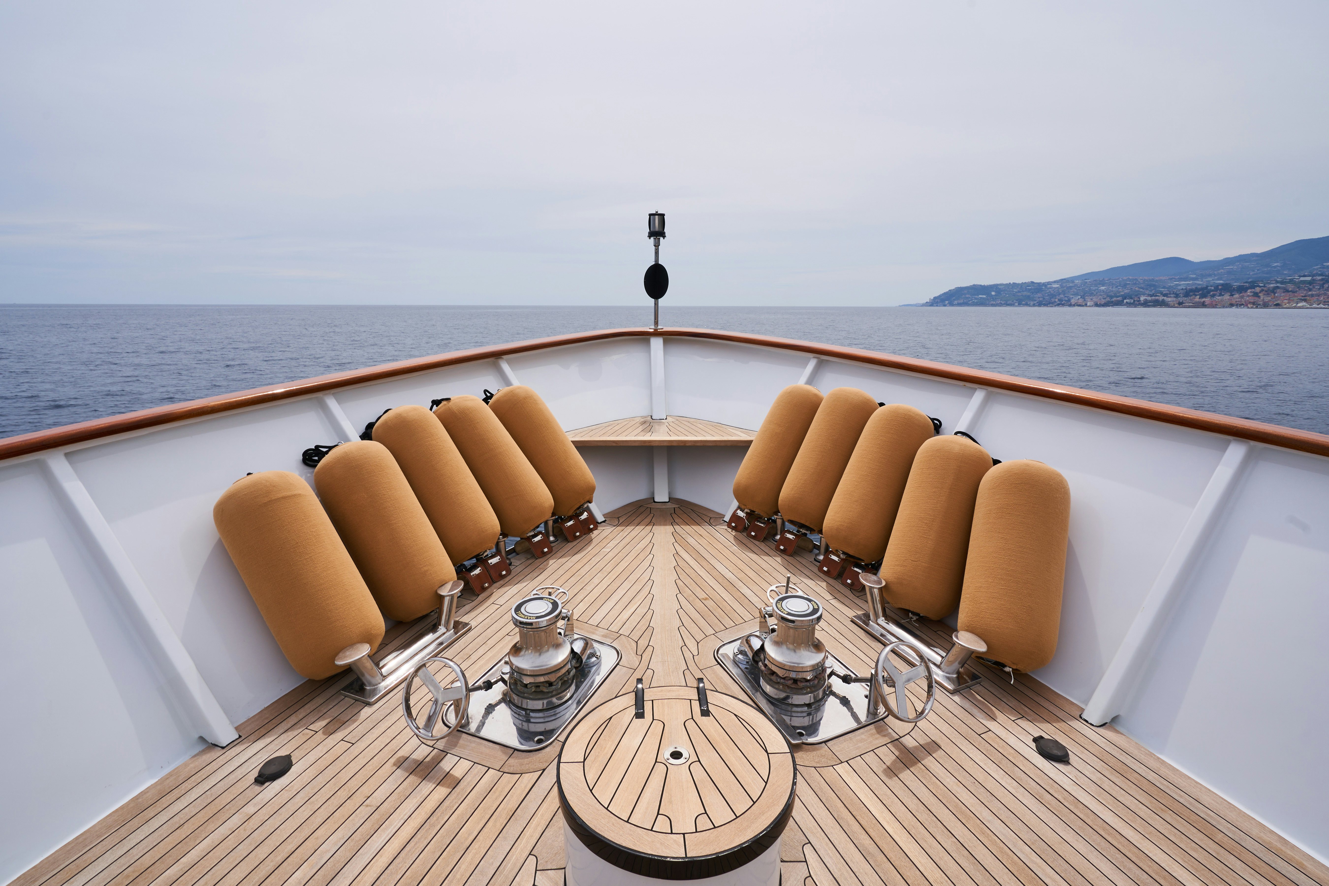 a wooden boat on the water aboard L'INSTANT IV Yacht for Sale