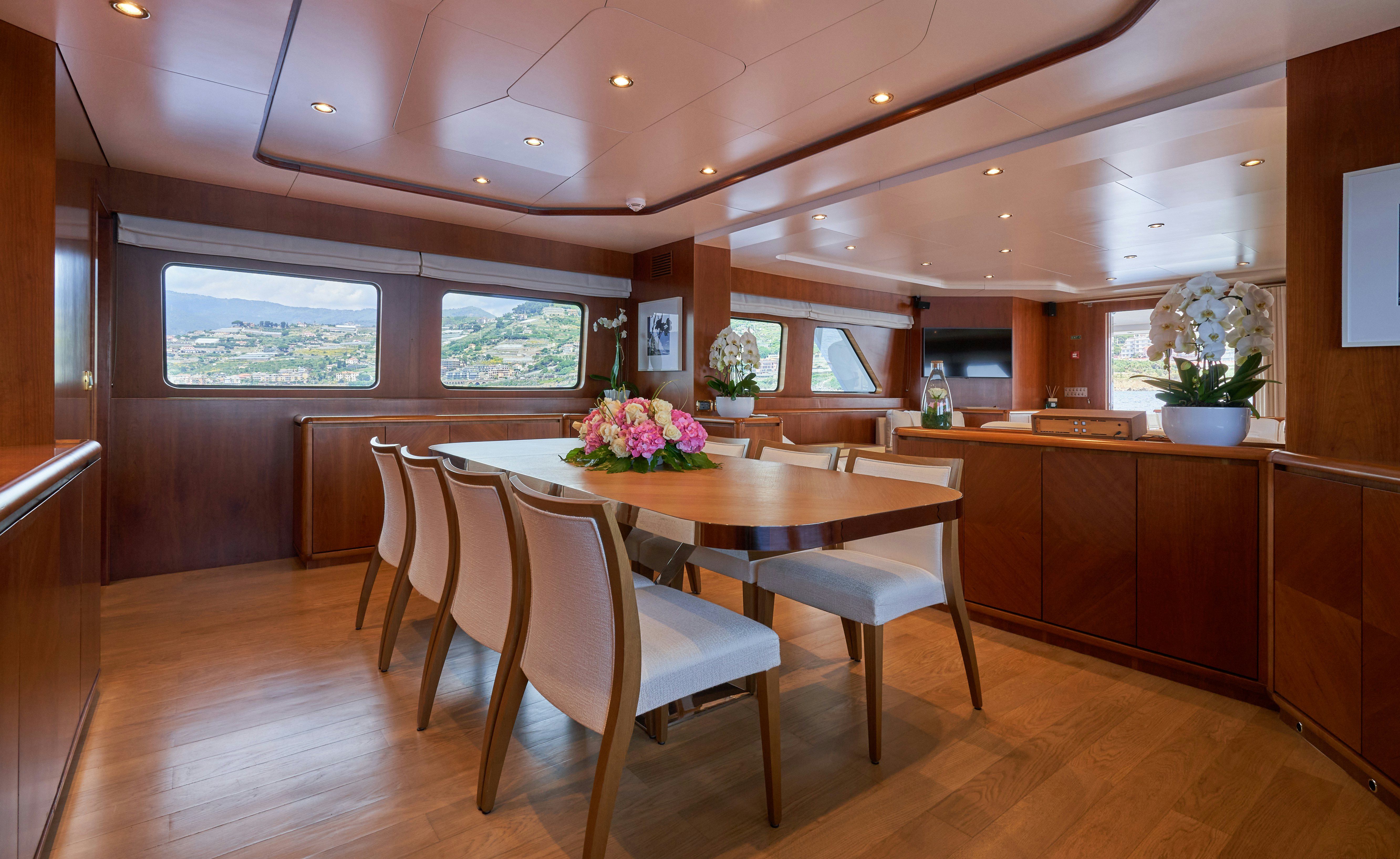 a kitchen and dining area aboard L'INSTANT IV Yacht for Sale
