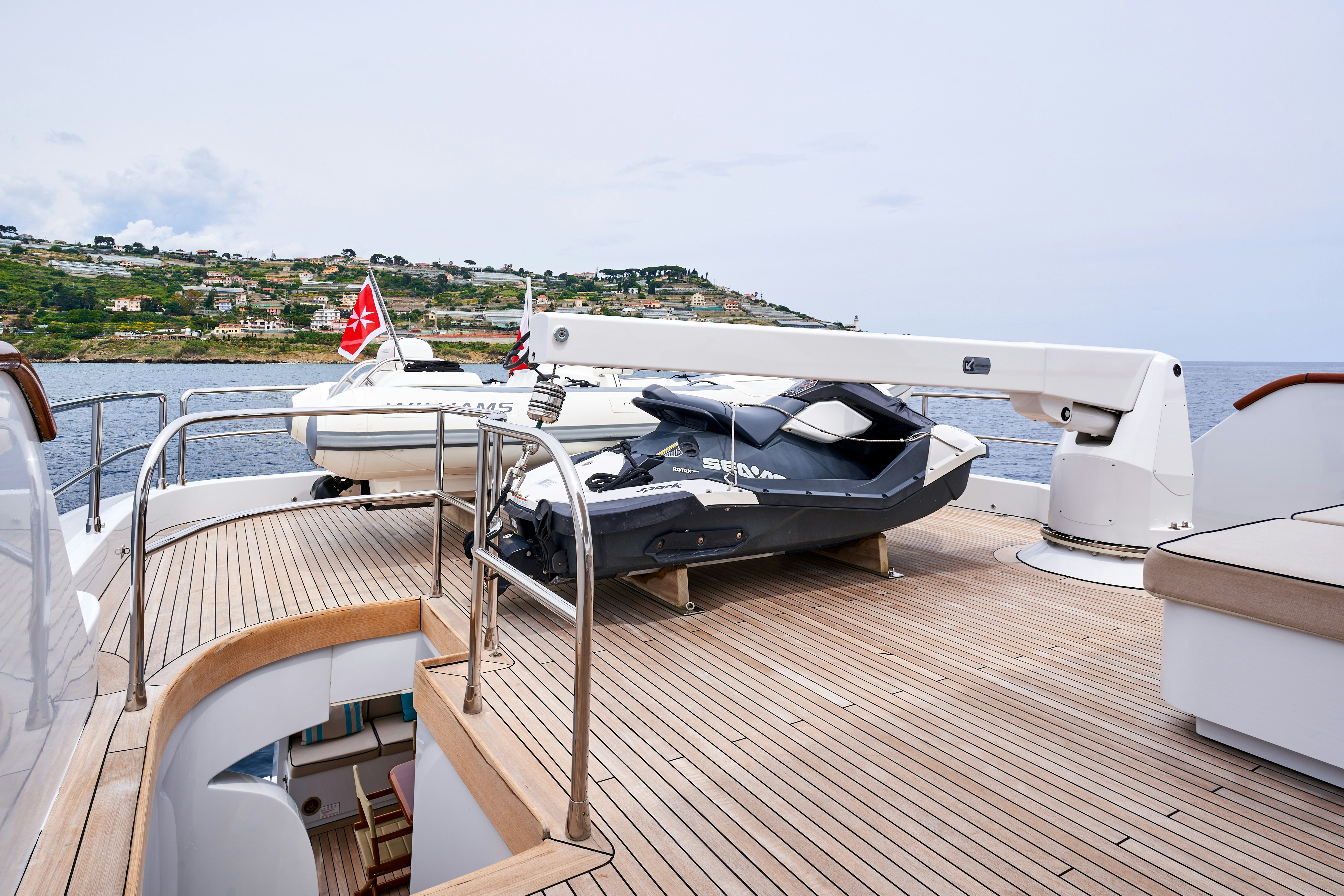 a boat on a deck aboard L'INSTANT IV Yacht for Sale
