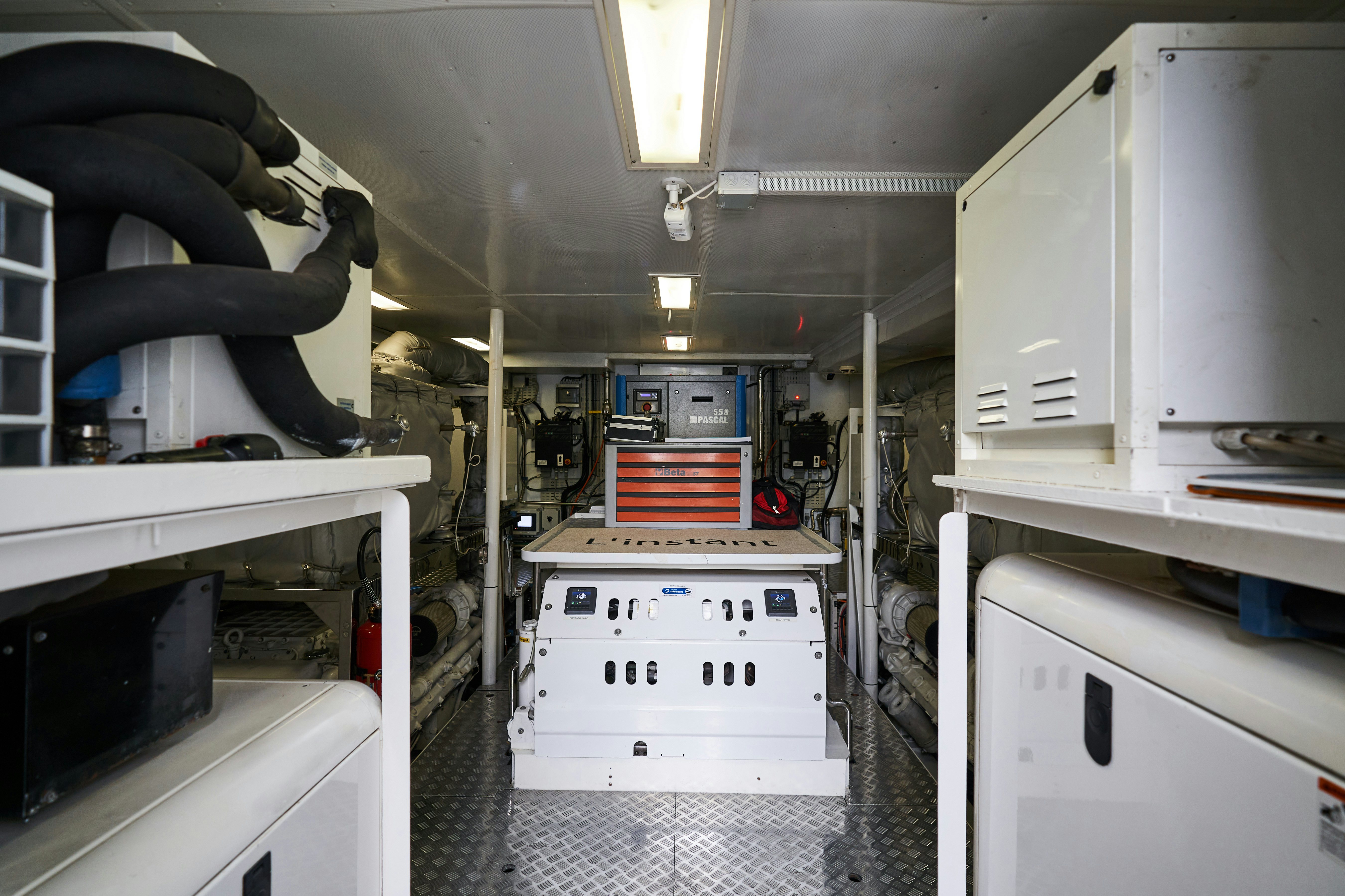 a room with white cabinets and white drawers aboard L'INSTANT IV Yacht for Sale