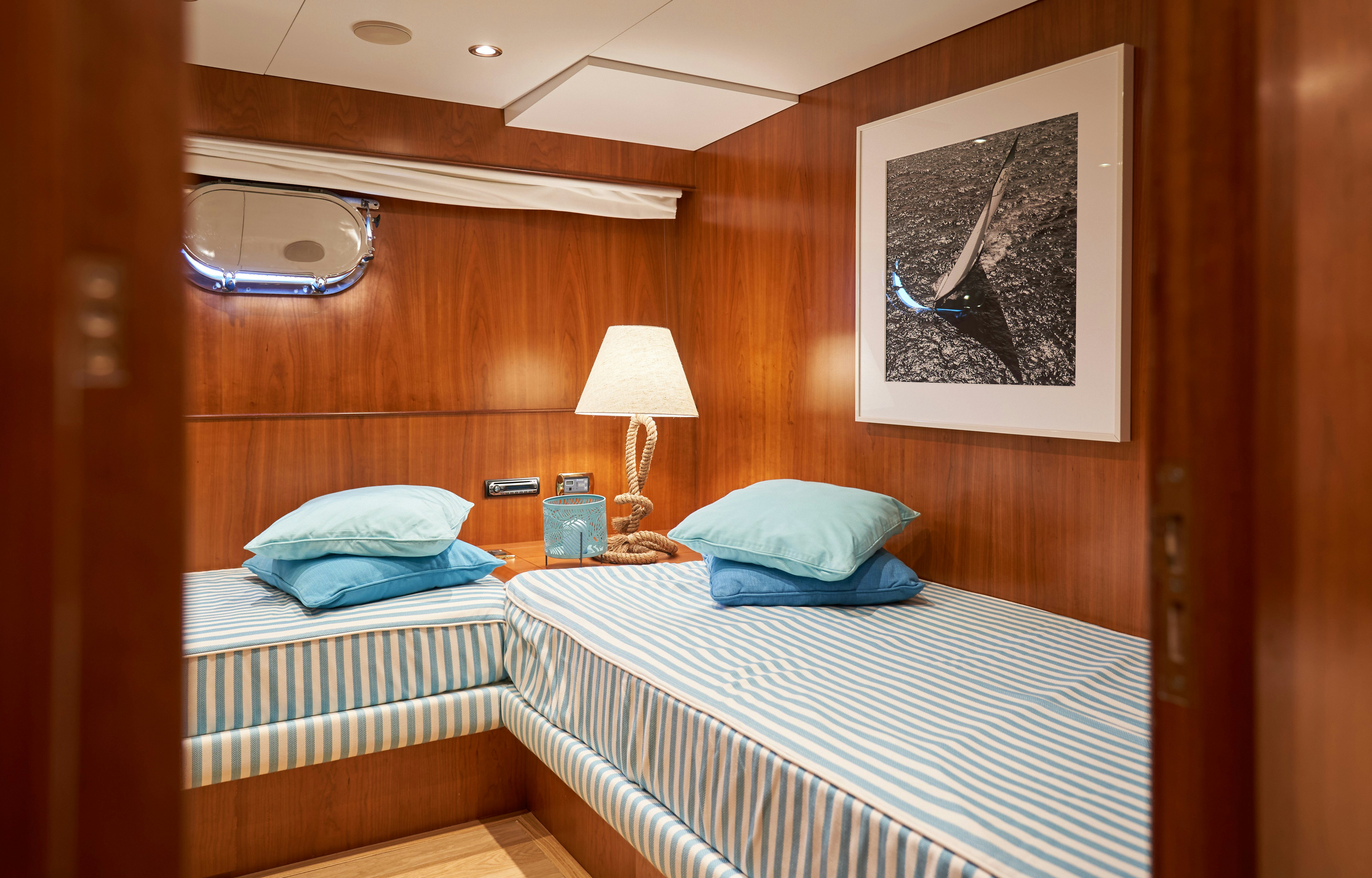 a couple of beds in a room aboard L'INSTANT IV Yacht for Sale