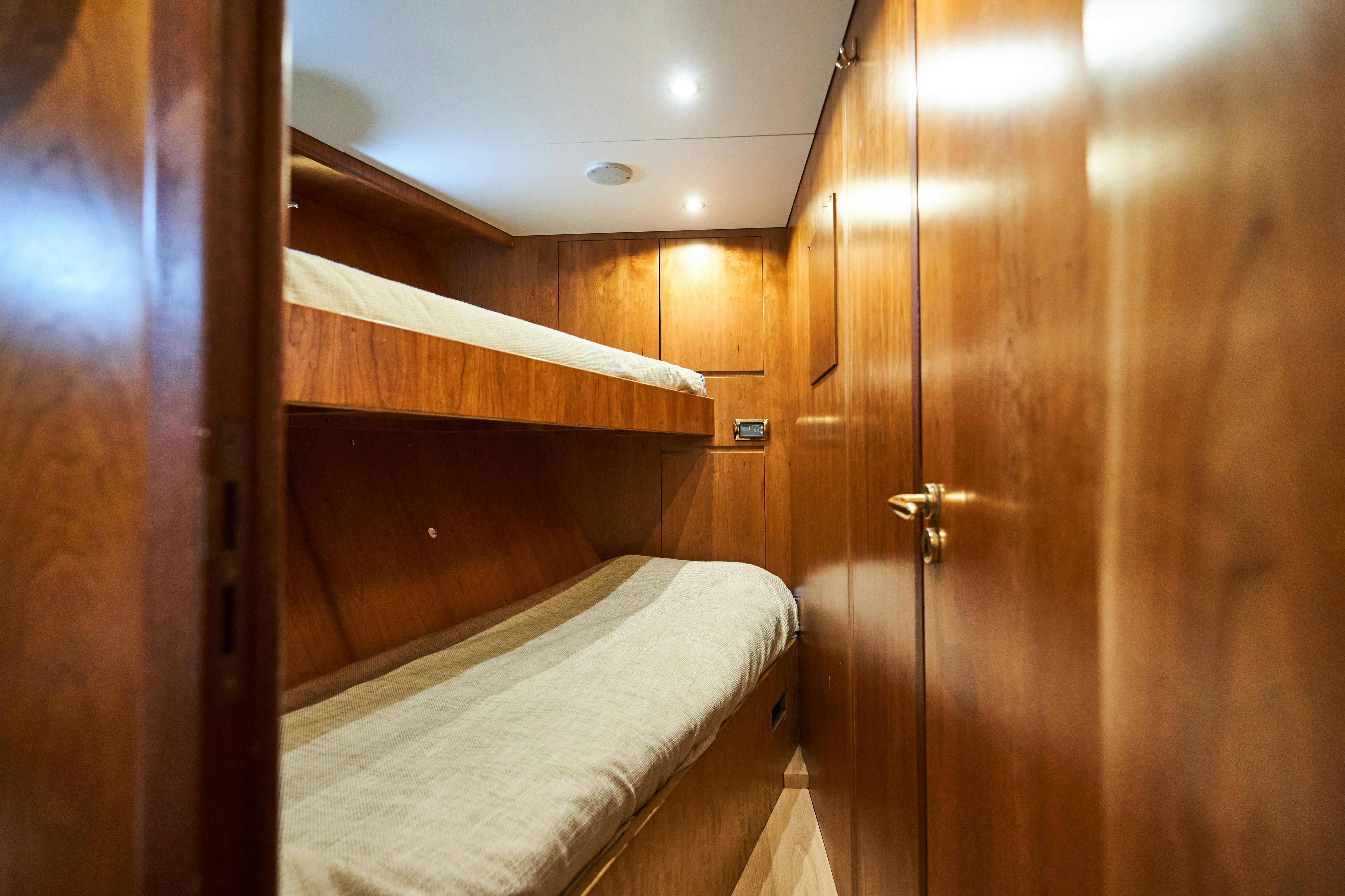 a bed in a room aboard L'INSTANT IV Yacht for Sale