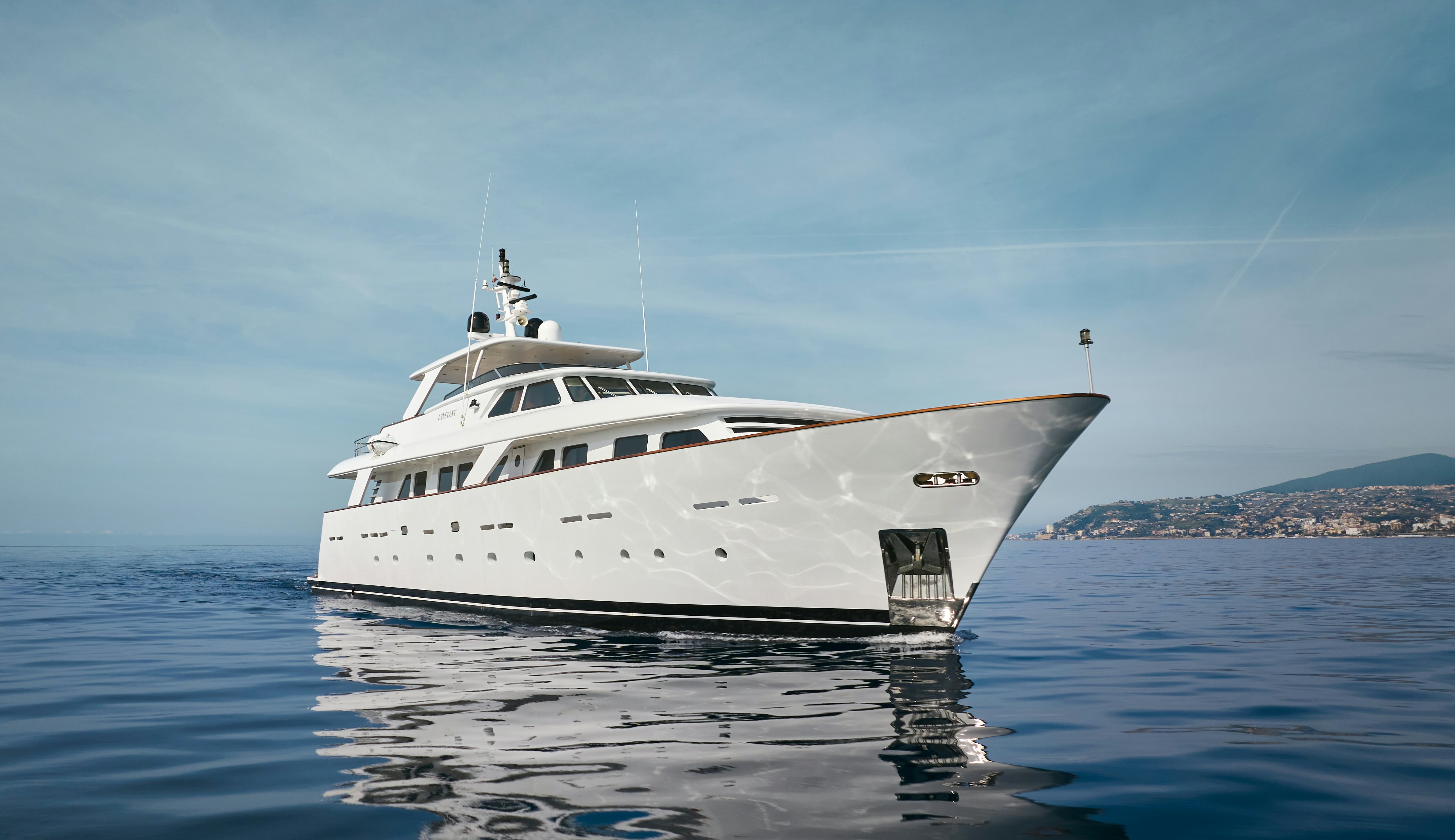 a white yacht in the water aboard L'INSTANT IV Yacht for Sale