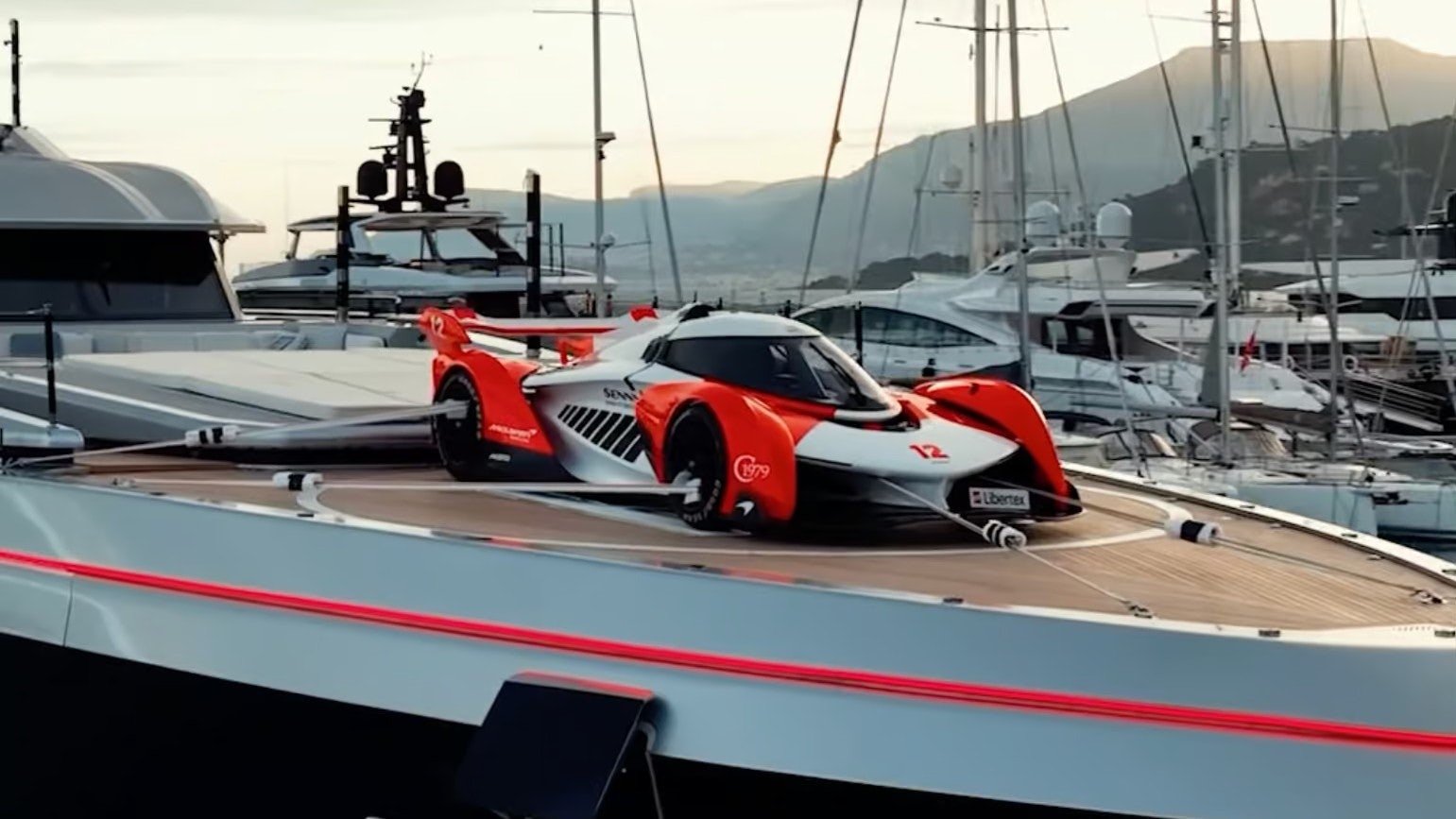 a red and white race car on a boat aboard SARASTAR Yacht for Charter