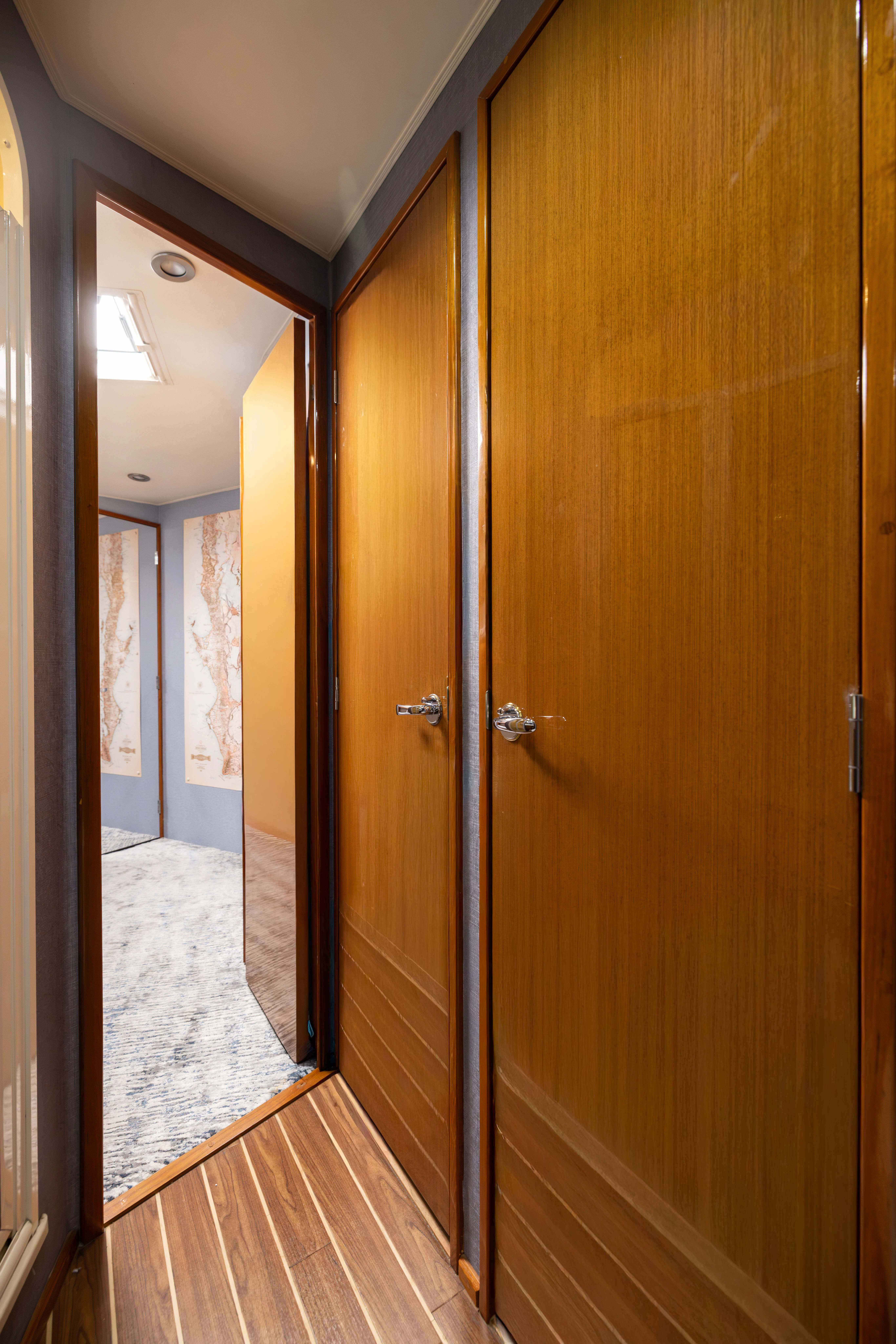 a hallway with a wood door aboard ANEJO Yacht for Sale