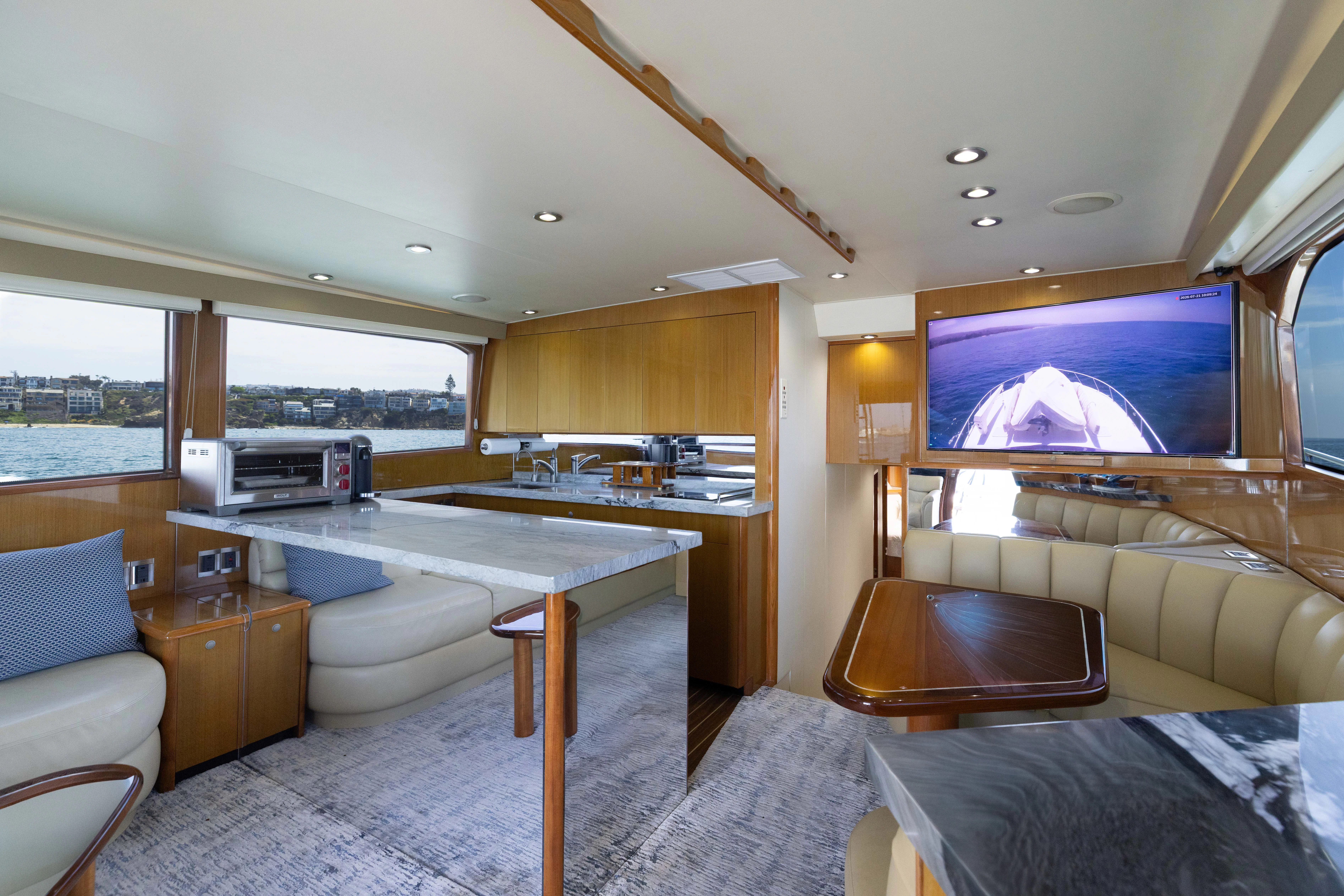 a large bedroom with a large flat screen tv and a large bed aboard ANEJO Yacht for Sale