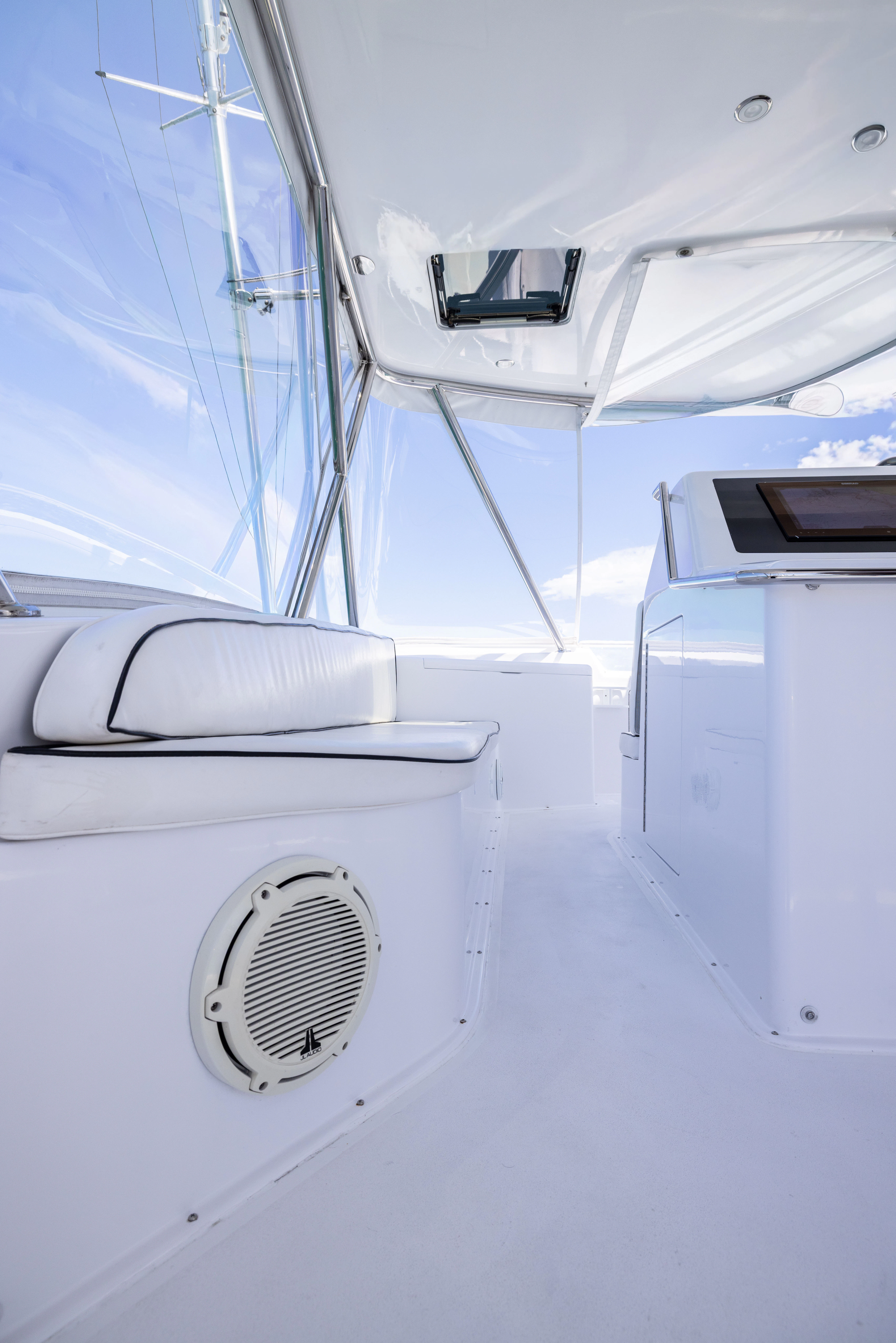 a white boat with a speaker on the front aboard ANEJO Yacht for Sale