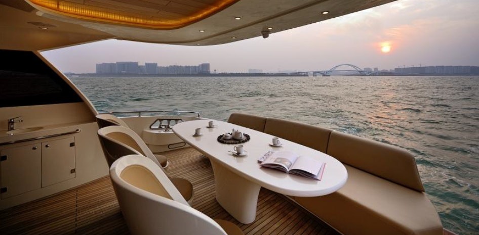 a boat with a table and chairs on it aboard ALLEGRO FLYBRIDGE 82 MODEL-X Yacht for Sale