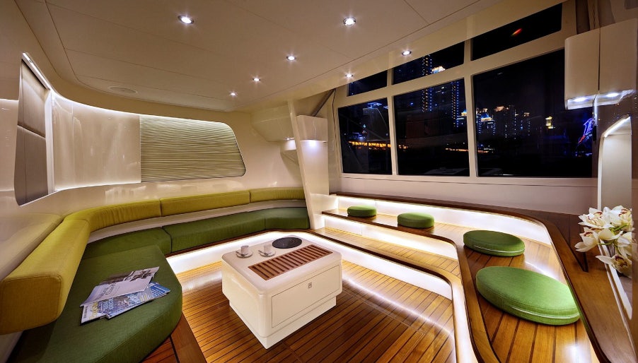 a room with a couch and a table aboard ALLEGRO FLYBRIDGE 82 MODEL-X Yacht for Sale
