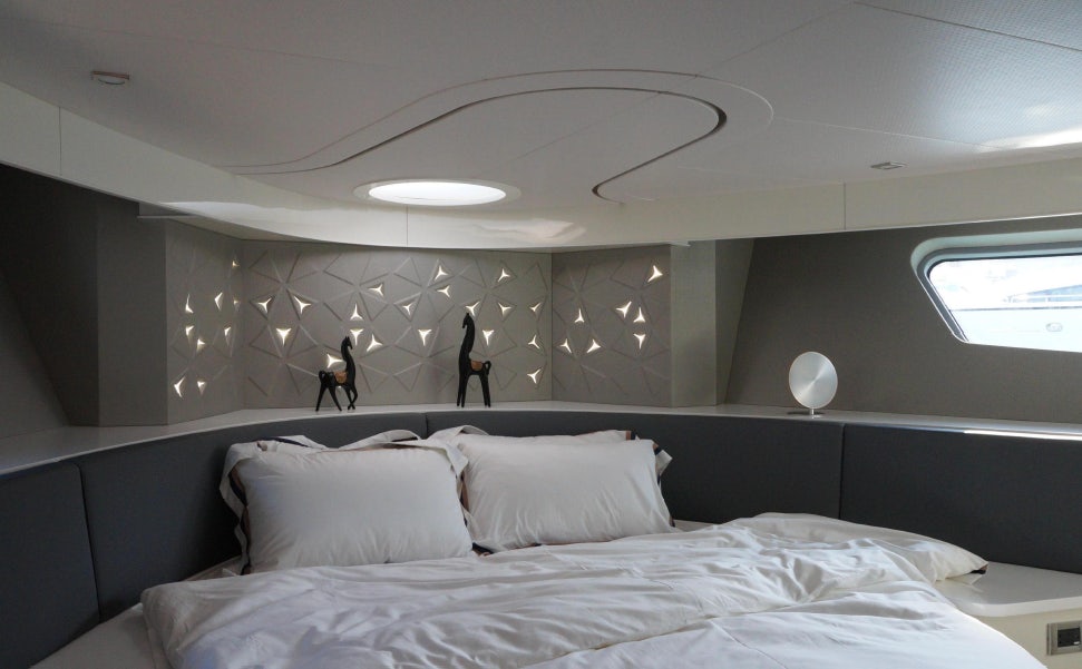 a room with a bed and a fan aboard ALLEGRO FLYBRIDGE 82 MODEL-X Yacht for Sale