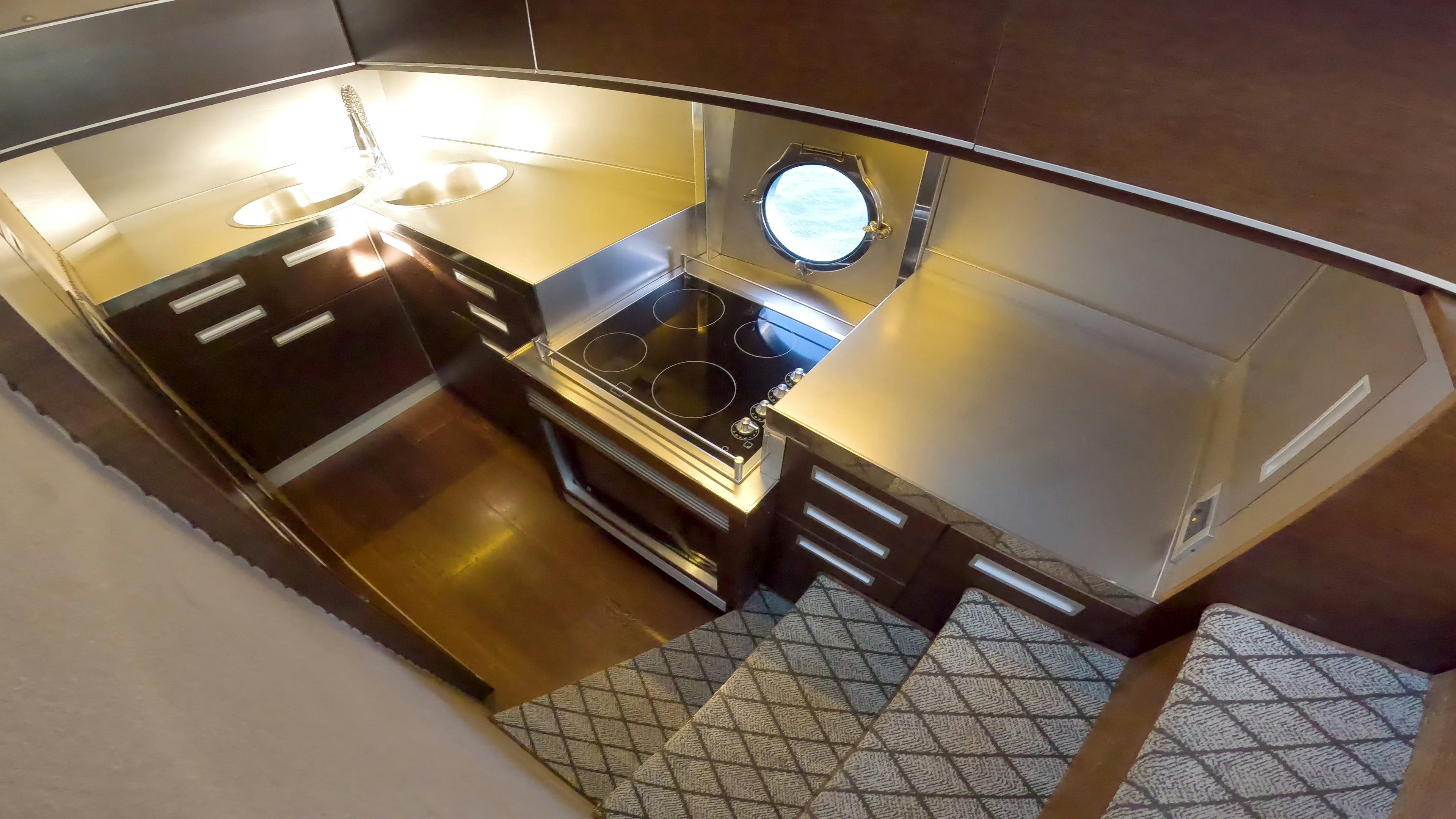 a kitchen with a stove and oven aboard BOAT Yacht for Sale